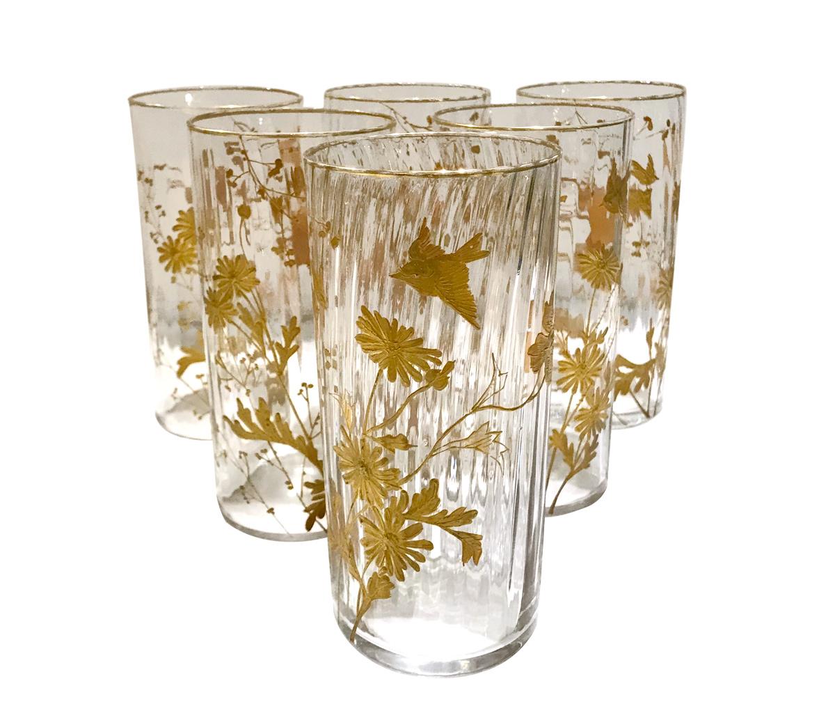Very refined set of Orangeade set composed of 1 jug and 6 glasses. Made of blown glass decorated with gold Japonisme-inspired patterns of birds, flowers and dragonflies. 
Produced by Maison Toy, a french luxury house specializing in both porcelain