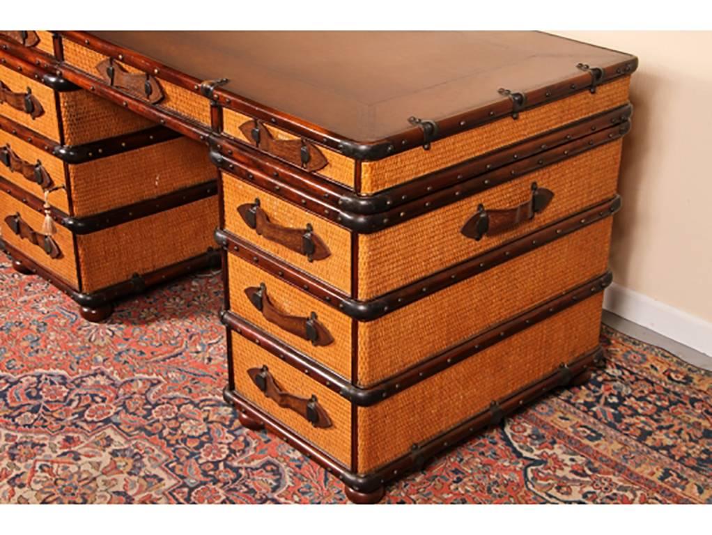 Three-part desk with tooled leather top and leather strap pulls, brass tack decoration, side strap handles
Left side with faux drawers is a door that reveals a sliding shelf storage. Right side lower drawer is a file drawer.
Finished hole on top
