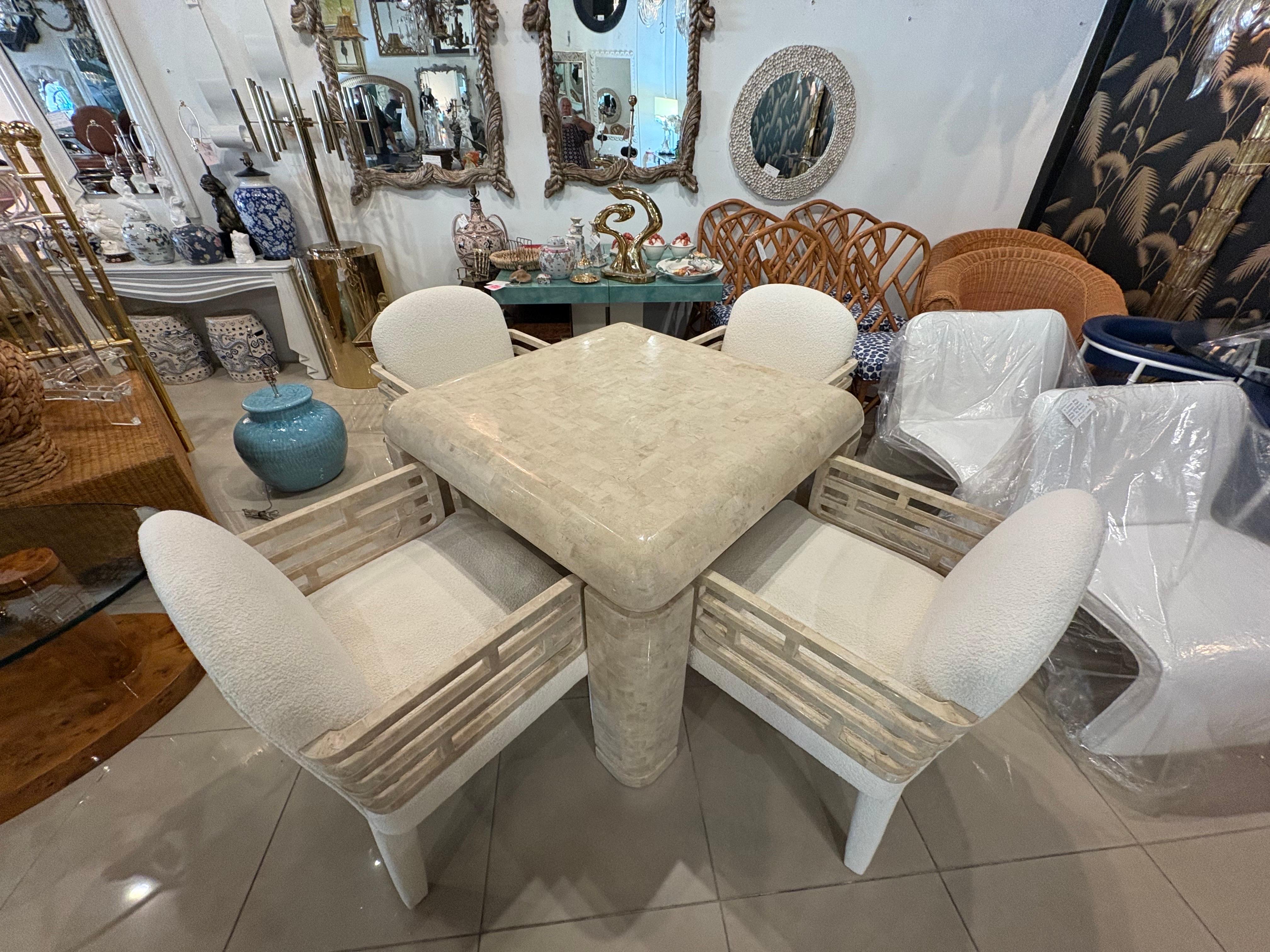 Exquisite set of 4 Maitland Smith arm chairs armchairs, dining or game. Tessellated marble stone arms. New upholstered, with all new insides, etc. Lovely Boucle soft oatmeal, newly upholstered. The game or dining table pictured, matches, and is sold