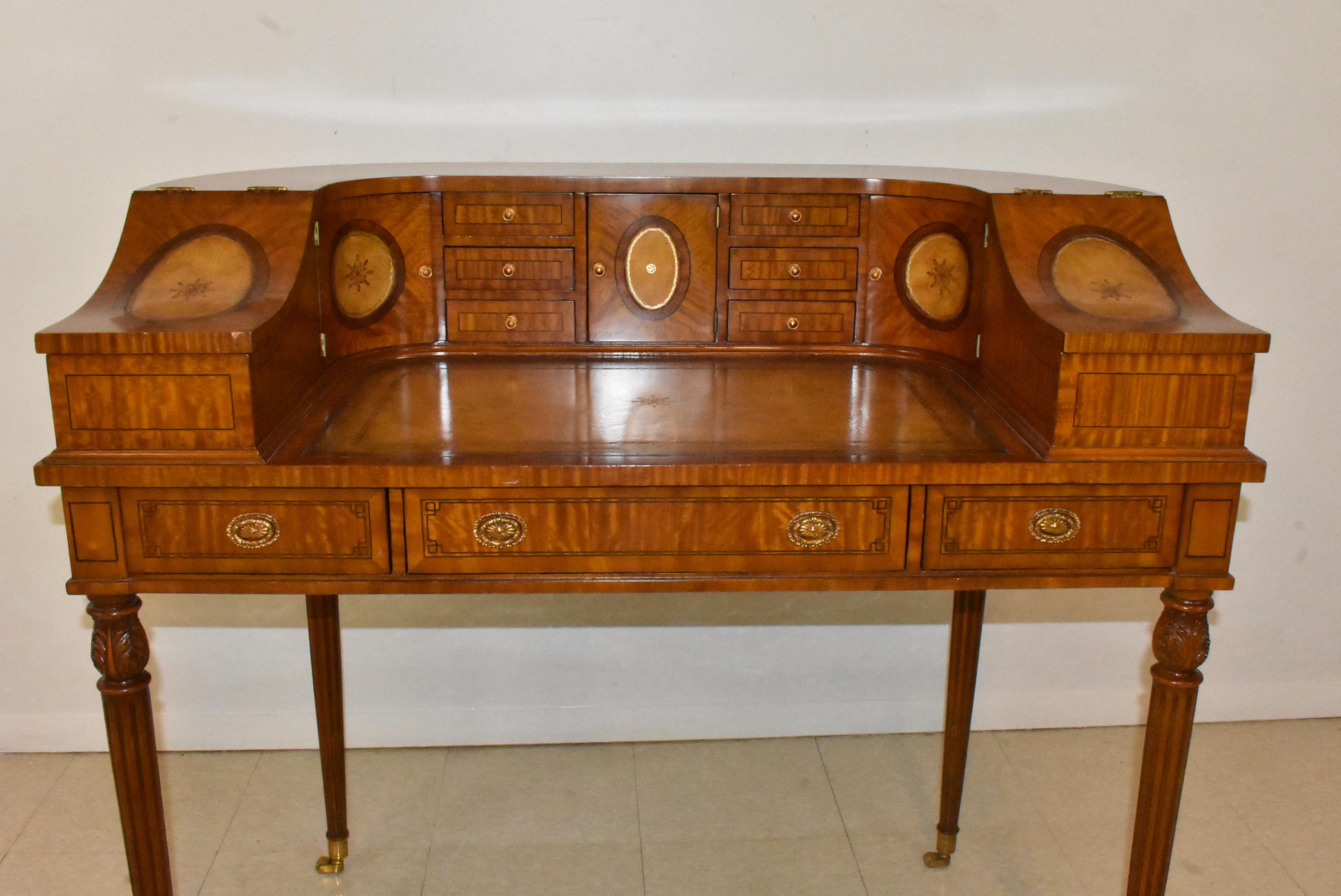 Maitland Smith cherry and satinwood Adams style Carlton house writing desk with tapered legs on bronze casters. Upper case with three drawers and a Carlton house compartmental set up on top. Tooled leather top and satinwood inlays. Legs feature