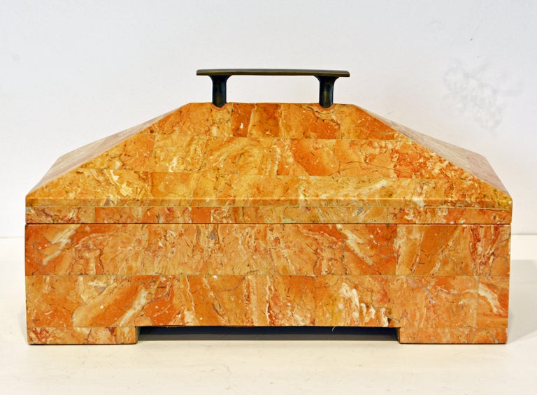 This Art Deco style tessellated sienna marble box features an architecturally themed form topped by an equally Minimalist style bronze handle. It is useful for many purposes and will compliment any desk of display area.
