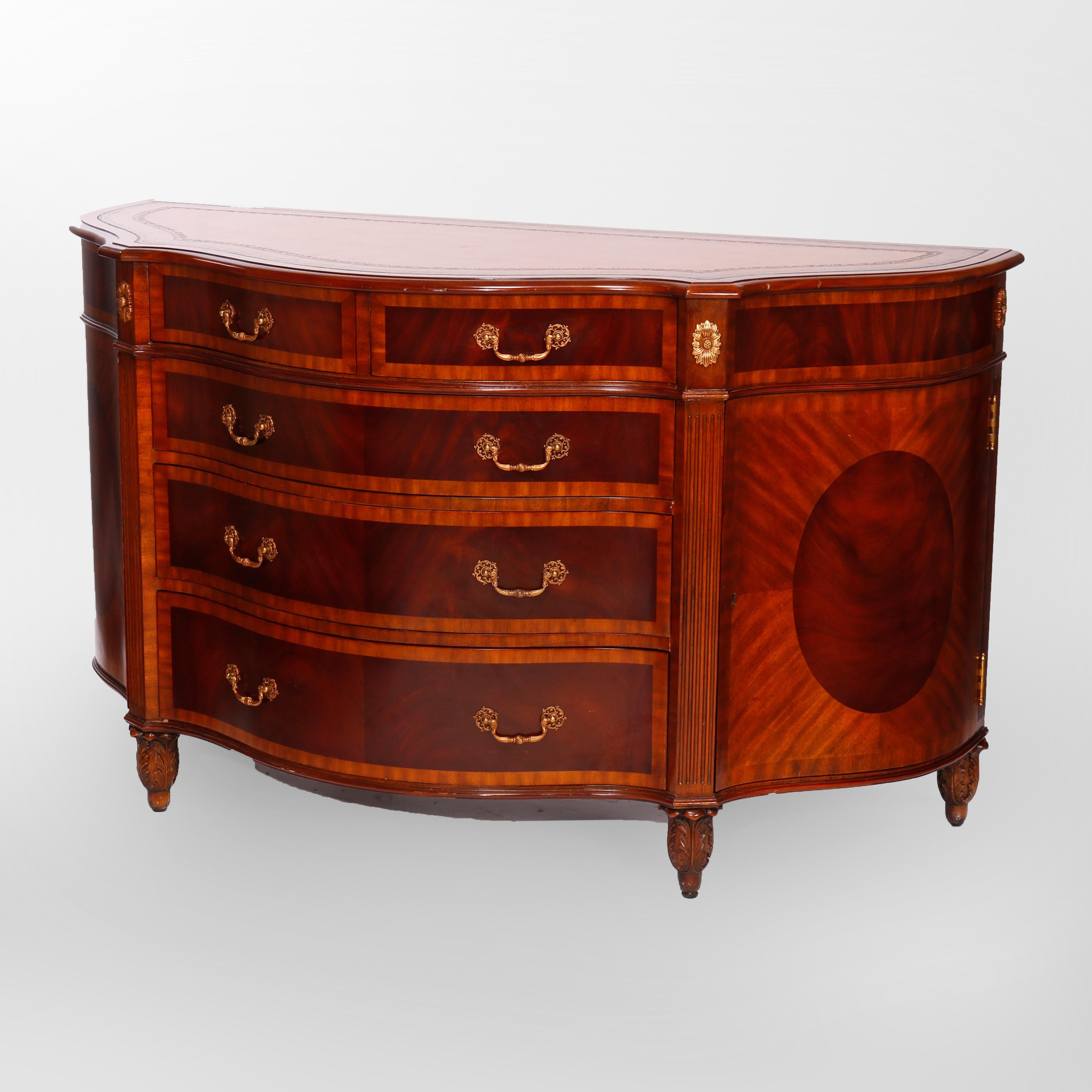 A sideboard by Maitland Smith offers inlaid mahogany and satinwood construction with shaped top having tooled leather surface over stylized demilune base with central drawer tower having two smaller upper drawers over three graduated long drawers