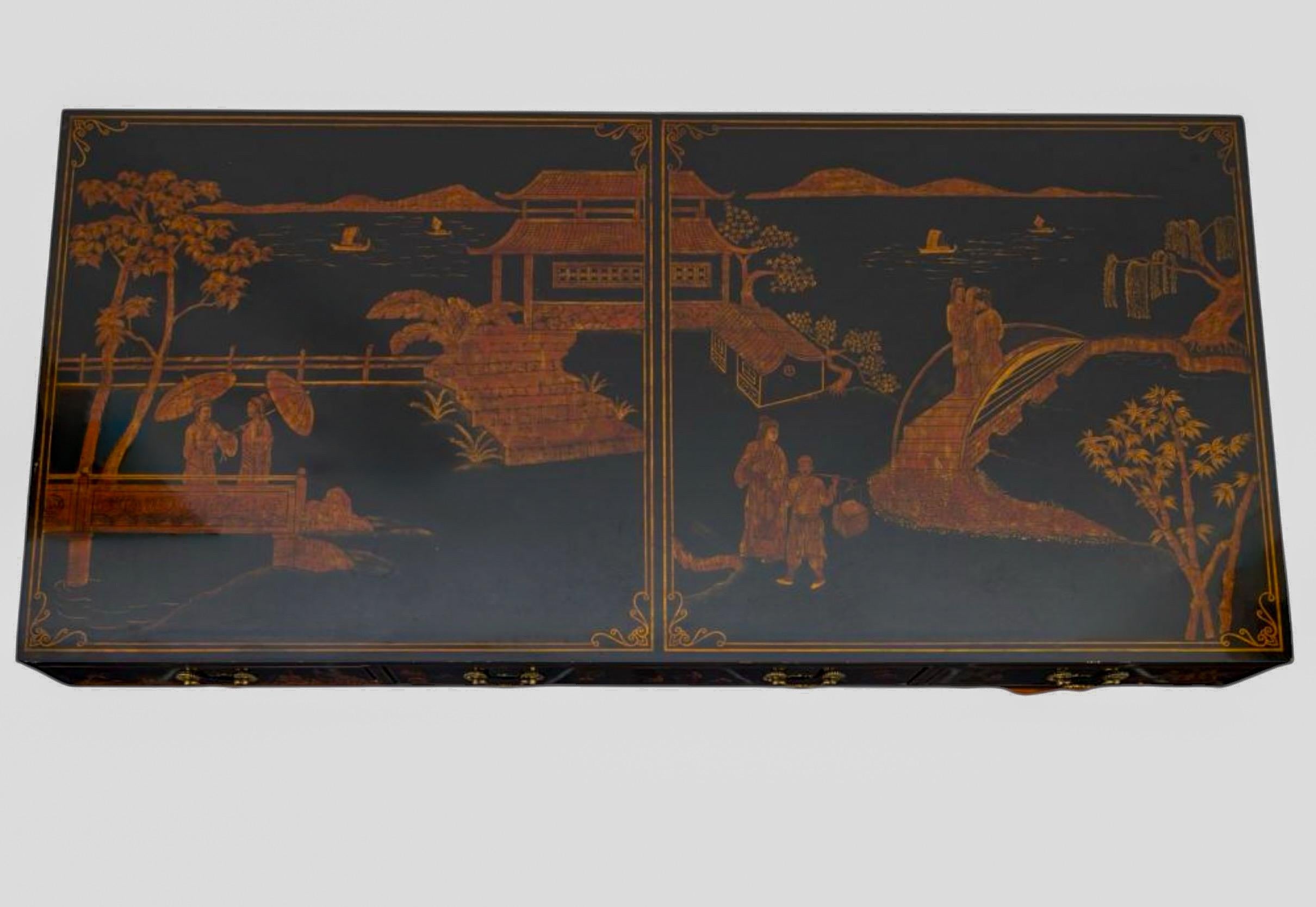 This is always a favorite find! This is a Chinese chippendale style desk by Maitland-Smith. The black lacquer chinoiserie top rests on two burnt bamboo bases, which makes shipping and moving much easier. It is reminiscent of the 19th century
