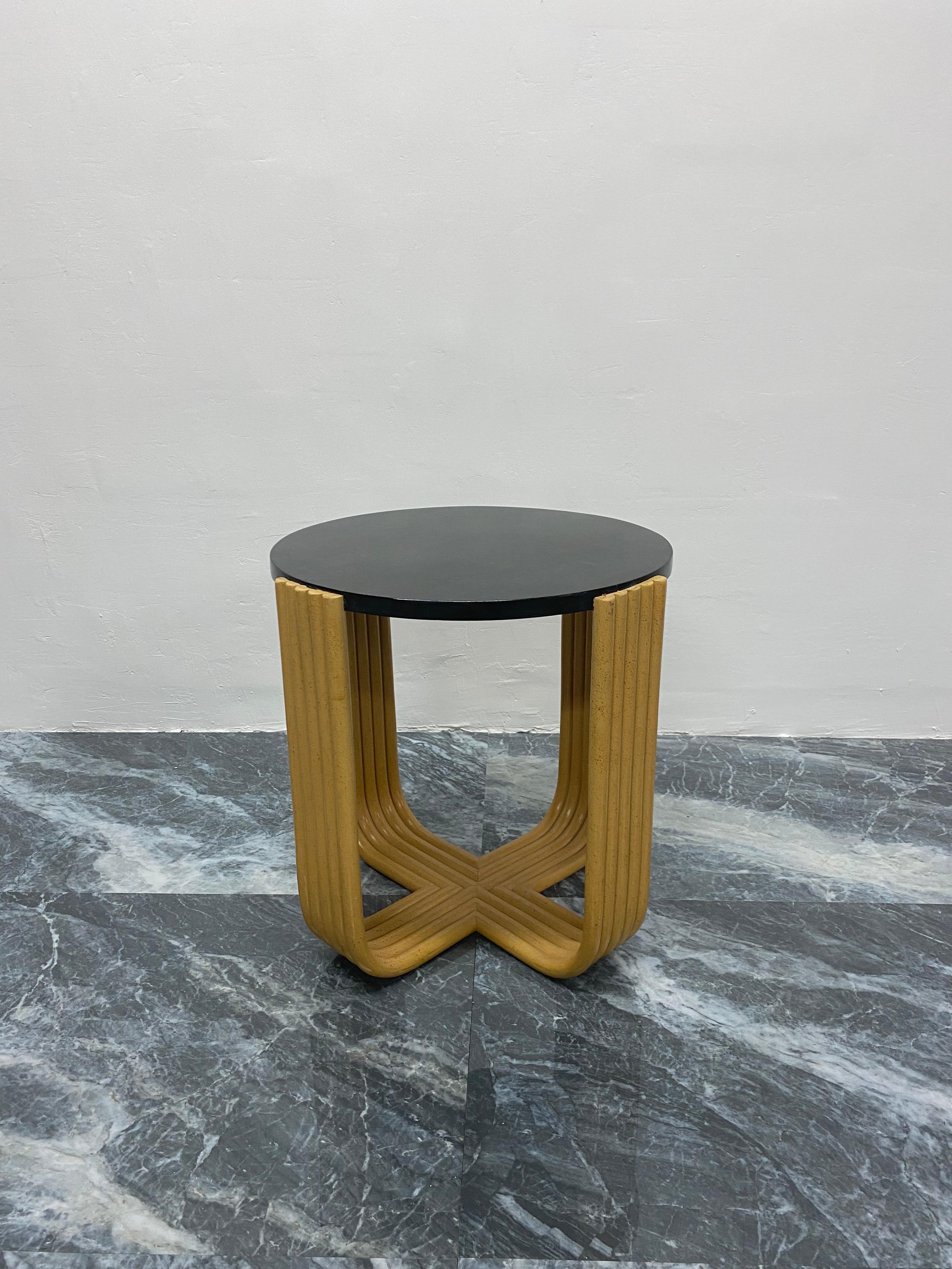 Side or occassional table with black tessellated stone top on a faux bamboo bent wood speckle painted base by Maitland Smith, 1980s.