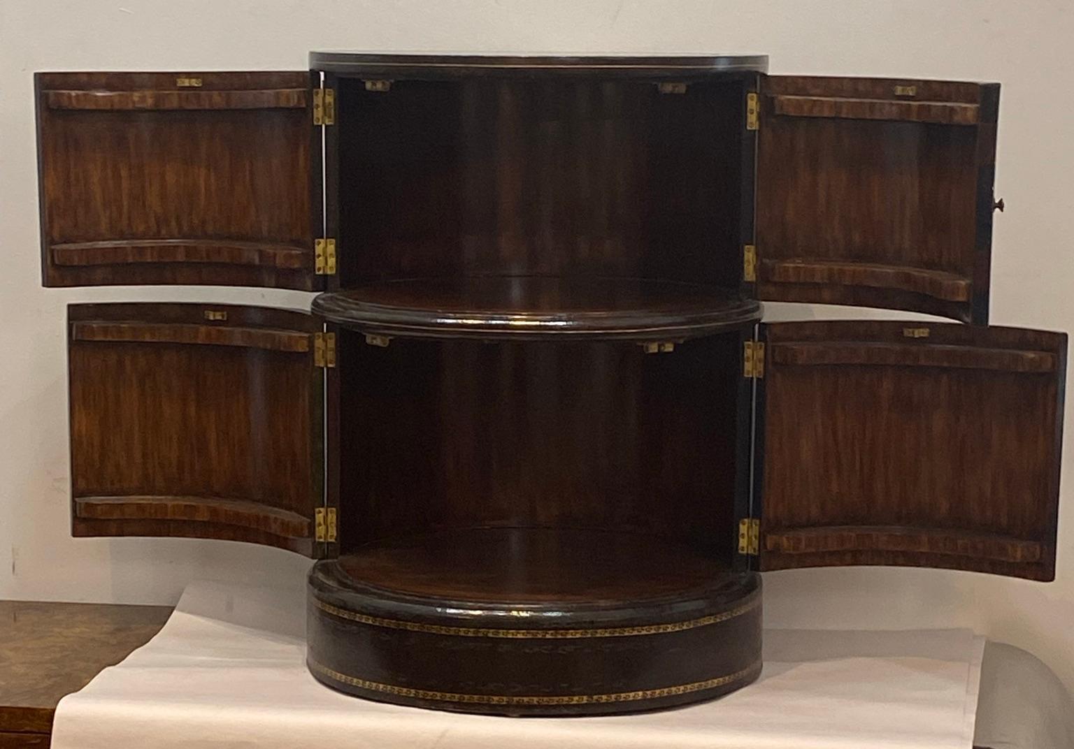 Tall Side Table leather top with interior shelves. Book shelf design made by Maitland Smith in the 1980s. In very good condition. Measures: 26 inches high with a 19 inch diameter.