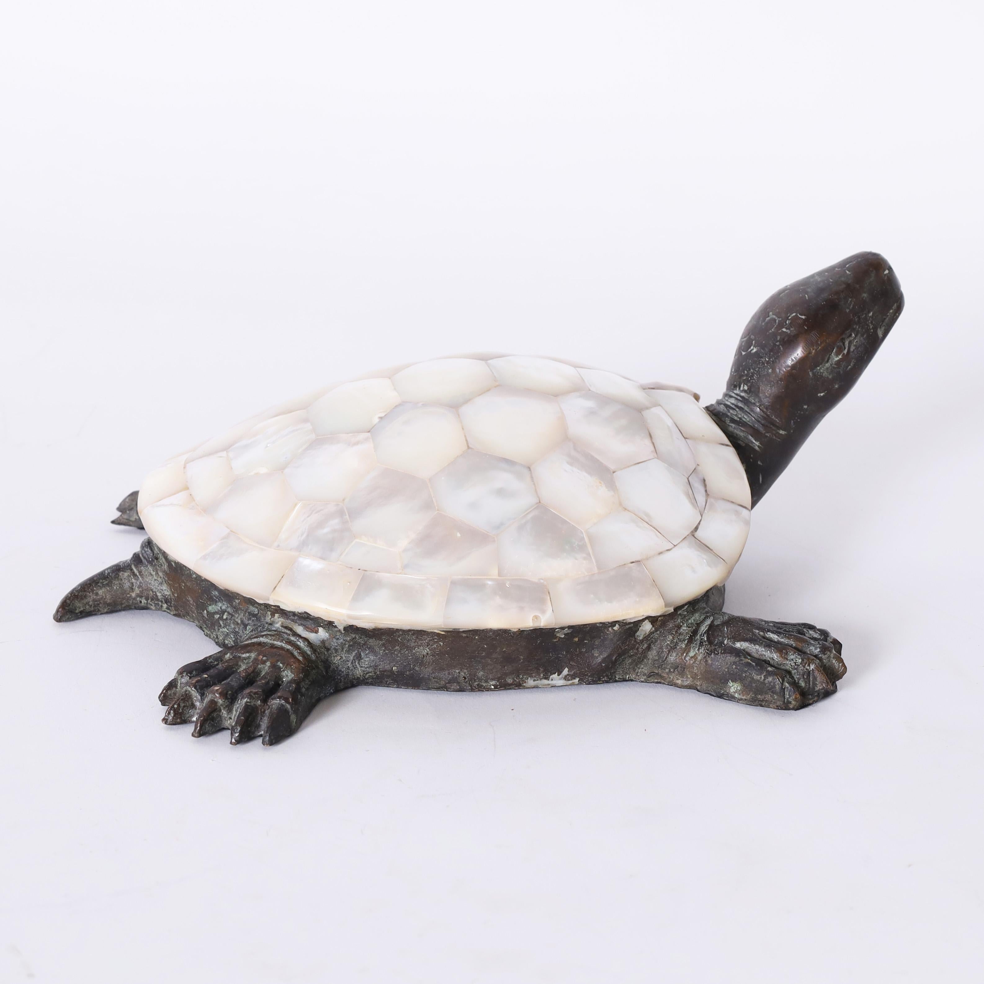 Charming vintage turtle sculpture or object of art crafted in bronze with a mother of pearl shell. Signed Maitland-Smith on the bottom. 