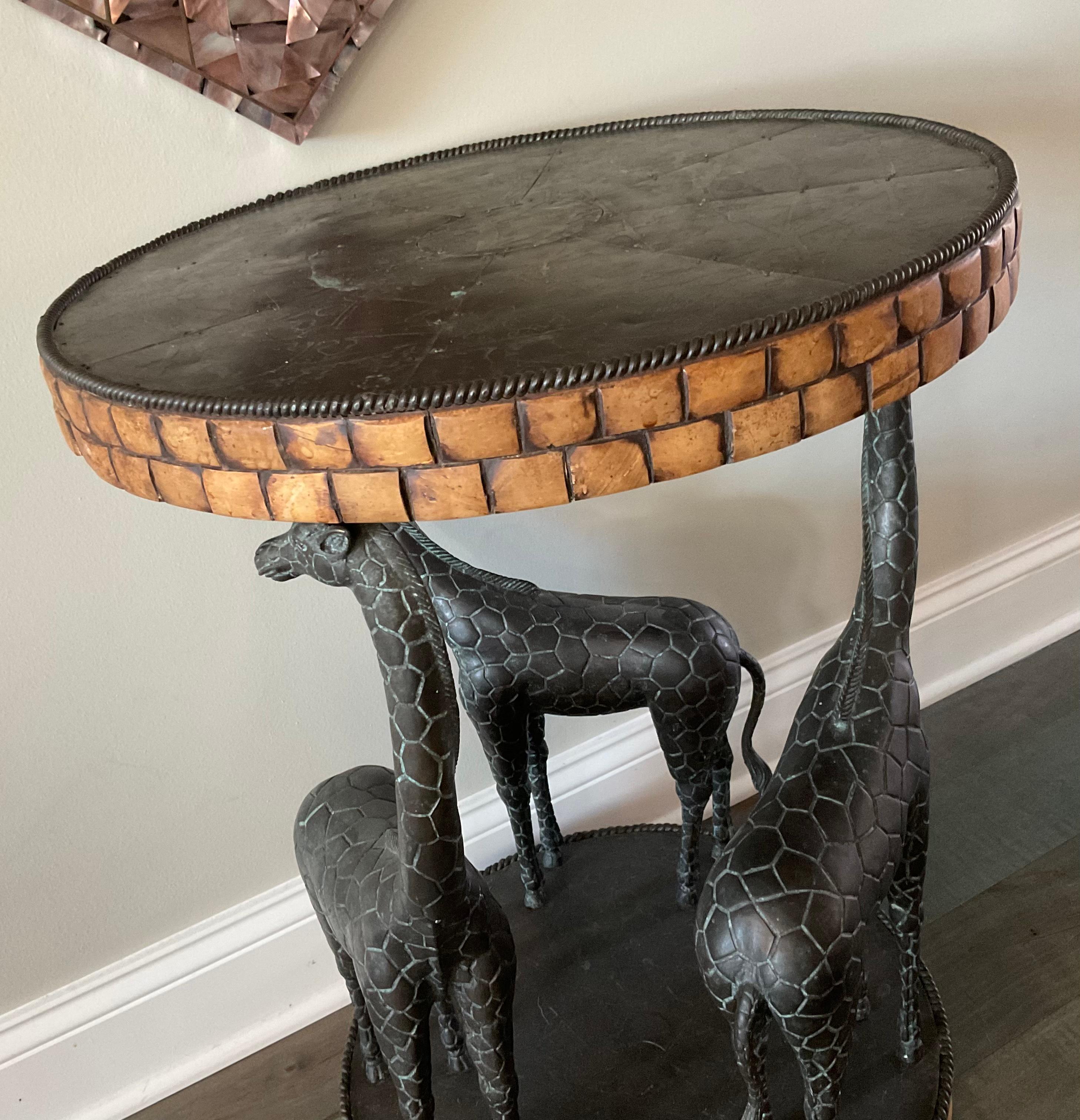 Amazing Maitland Smith side or end table with bronze sculptural giraffes. We have it displayed in the entry way, under a large tessellated mirror. Table will look great anywhere.