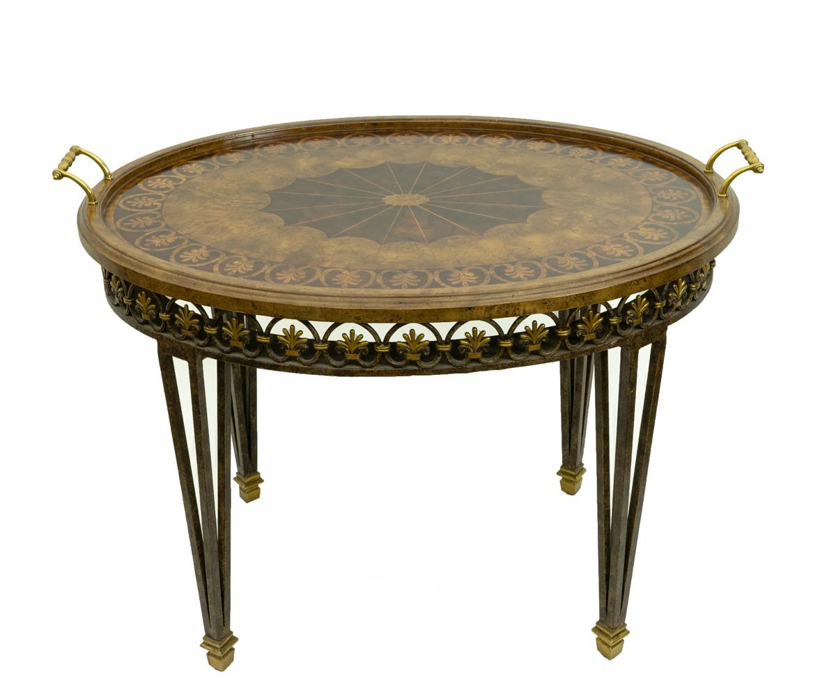 Impressive neoclassical style tea table with removable tray decorated in inlay satin wood with heavy bronze and brass base.