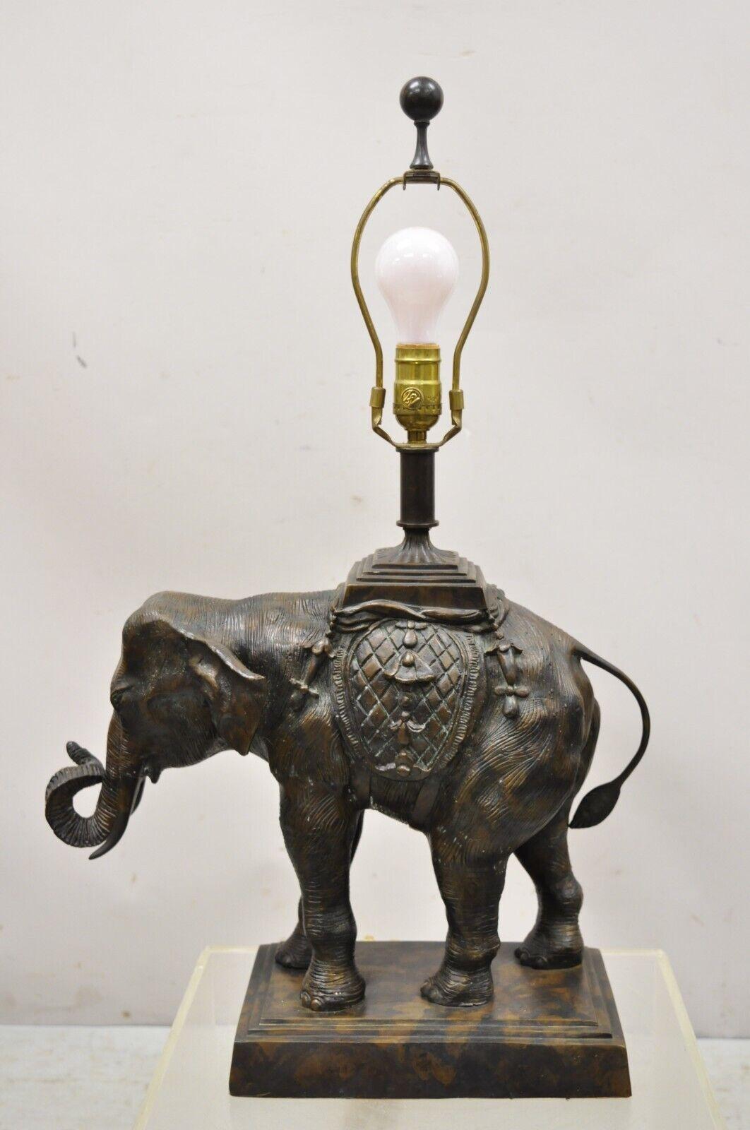 Maitland Smith bronze figural elephant table lamp faux tooled leather shade (B). Item features a cast bronze figural elephant, remarkable detail, original faux leather tooled shade, very nice vintage item, quality craftsmanship, great style and