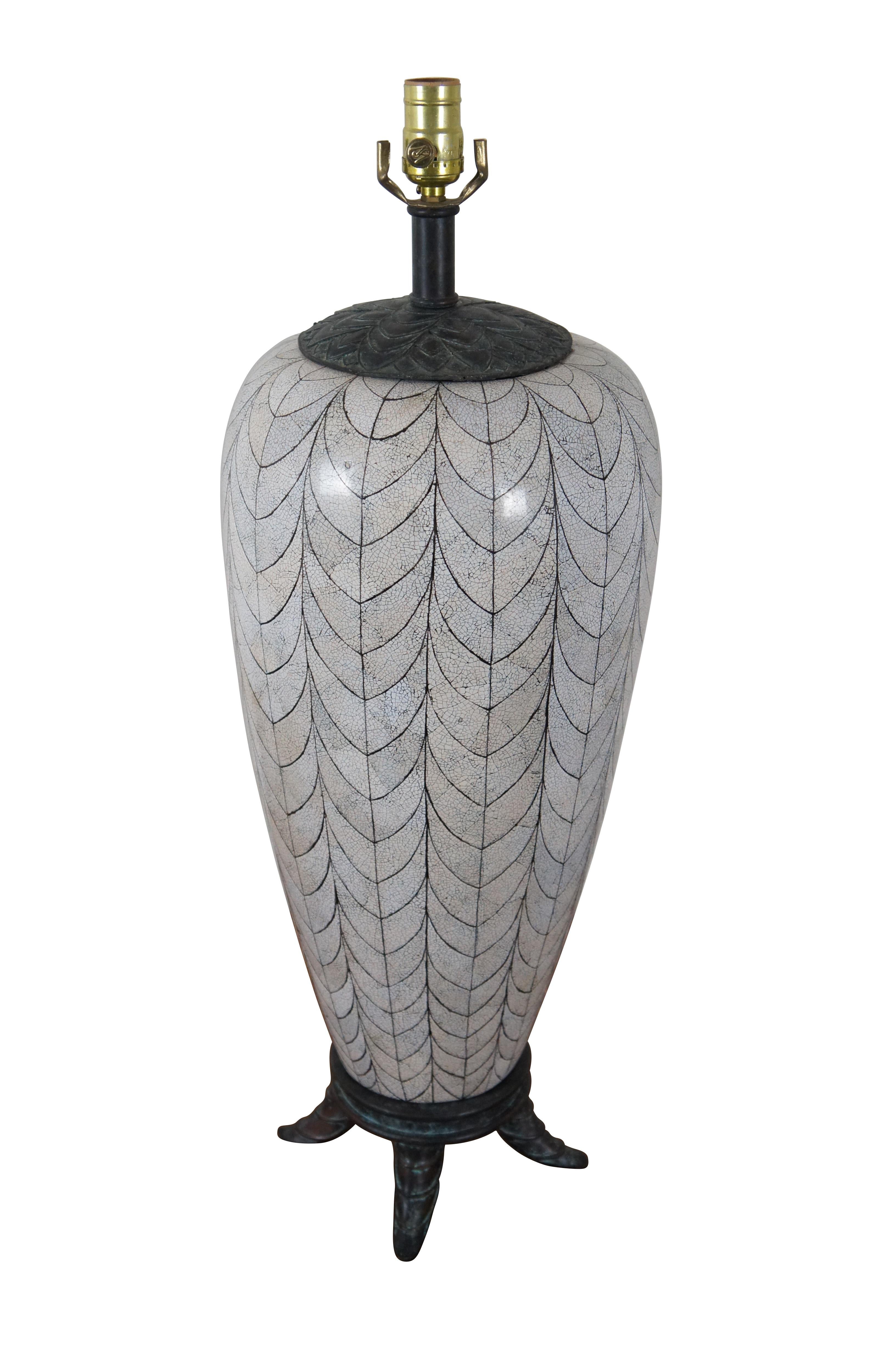 Vintage Maitland Smith table in the shape of a tall ginger jar / urn featuring a white shell mosaic in a scalloped feather or leaf vein pattern under a smooth lacquer finish. Lotus flower lid and round footed base are bronze with a factory