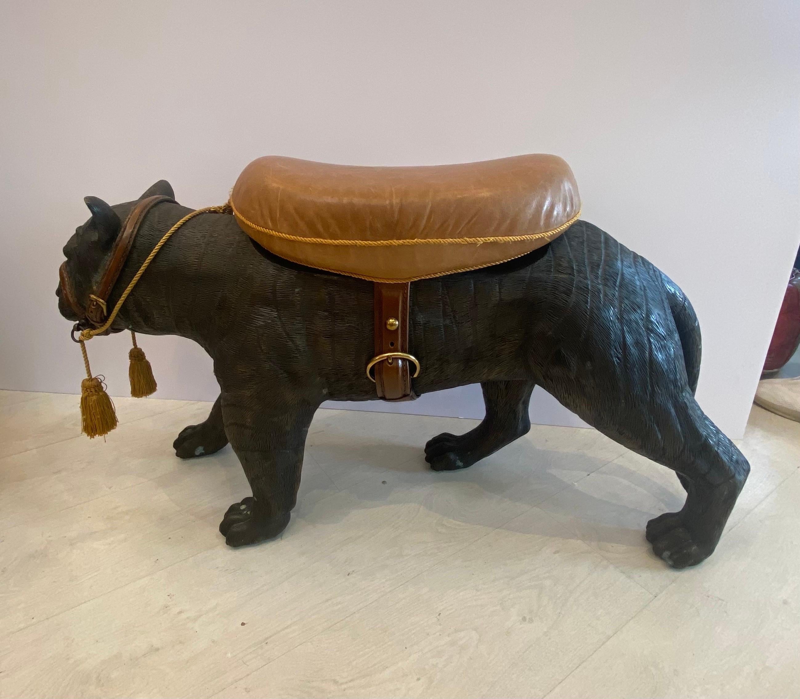 A rare cast bronze Maitland Smith tiger..With leather harness and leather cushioned seat adorned with gold tassels… Dimensions 36 inches long by 13 inches wide by 21 inches tall… labeled Maitland Smith label on the belly.