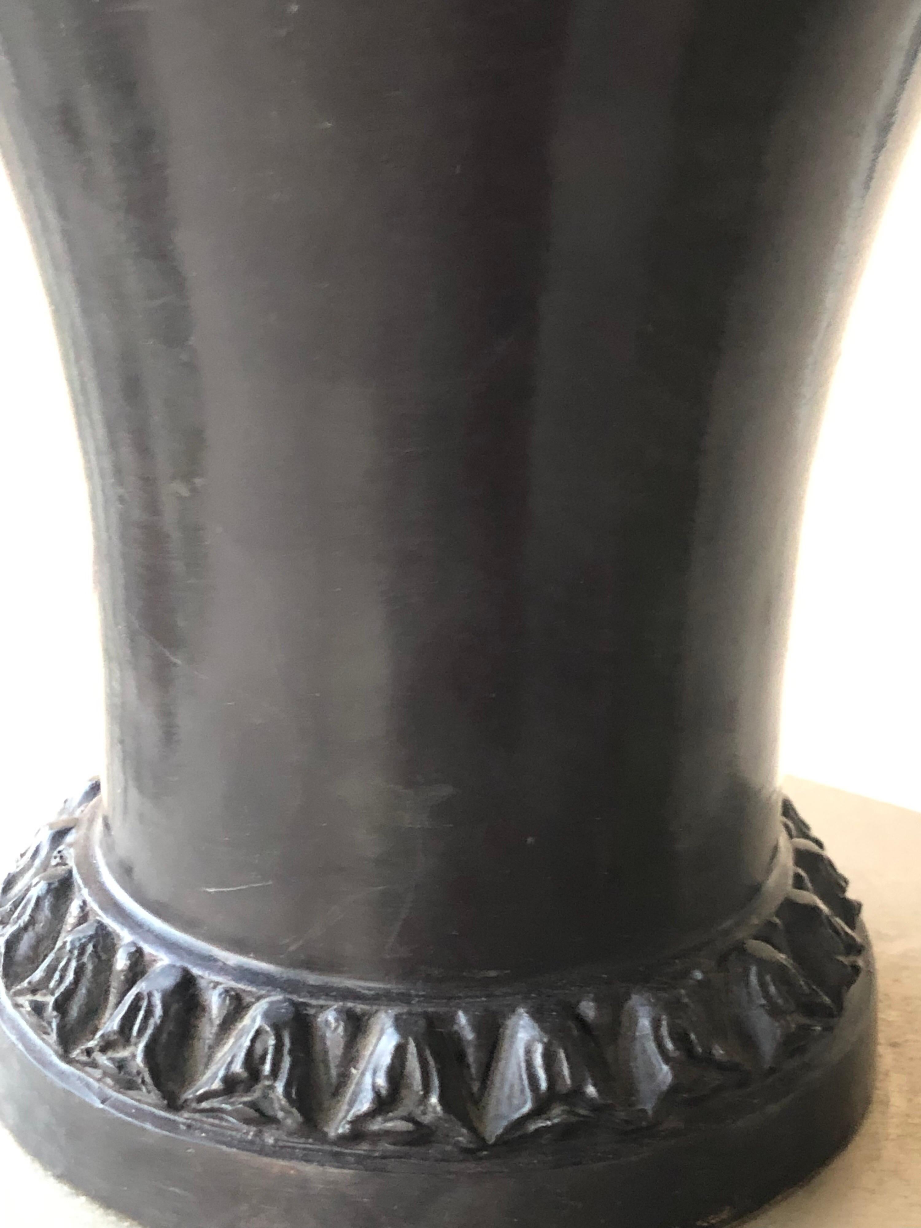 This lovely and very heavy urn was designed and made by Maitland Smith. Detail on the piece is amazing with beautiful handles with the face of a woman and intricate bronze top. From a very chic Palm Springs estate.