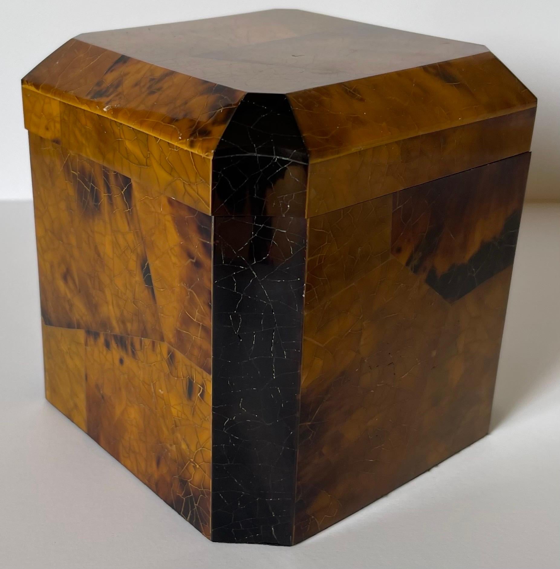 1980s decorative pen shell cube box attributed to Maitland Smith. Medium brown pen shell with dark gray tessellated stone accents. Wood lined box. No makers mark or signature.