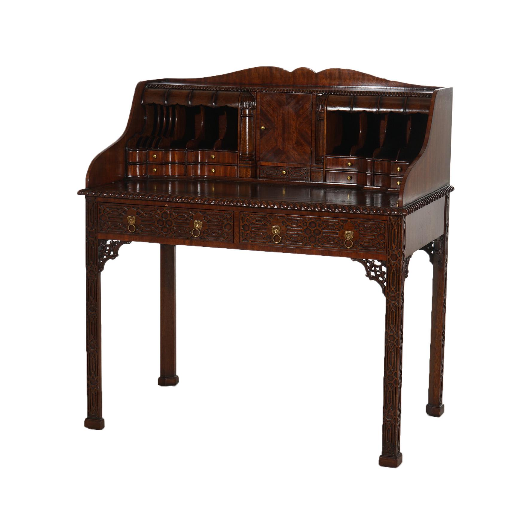 ***Ask About Reduced In-House Delivery Rates - Reliable Professional Service & Fully Insured***
A Chinese Chippendale style desk set by Maitland Smith offers mahogany desk with shaped rail over pigeon hole backsplash, pierced corbels and raised on