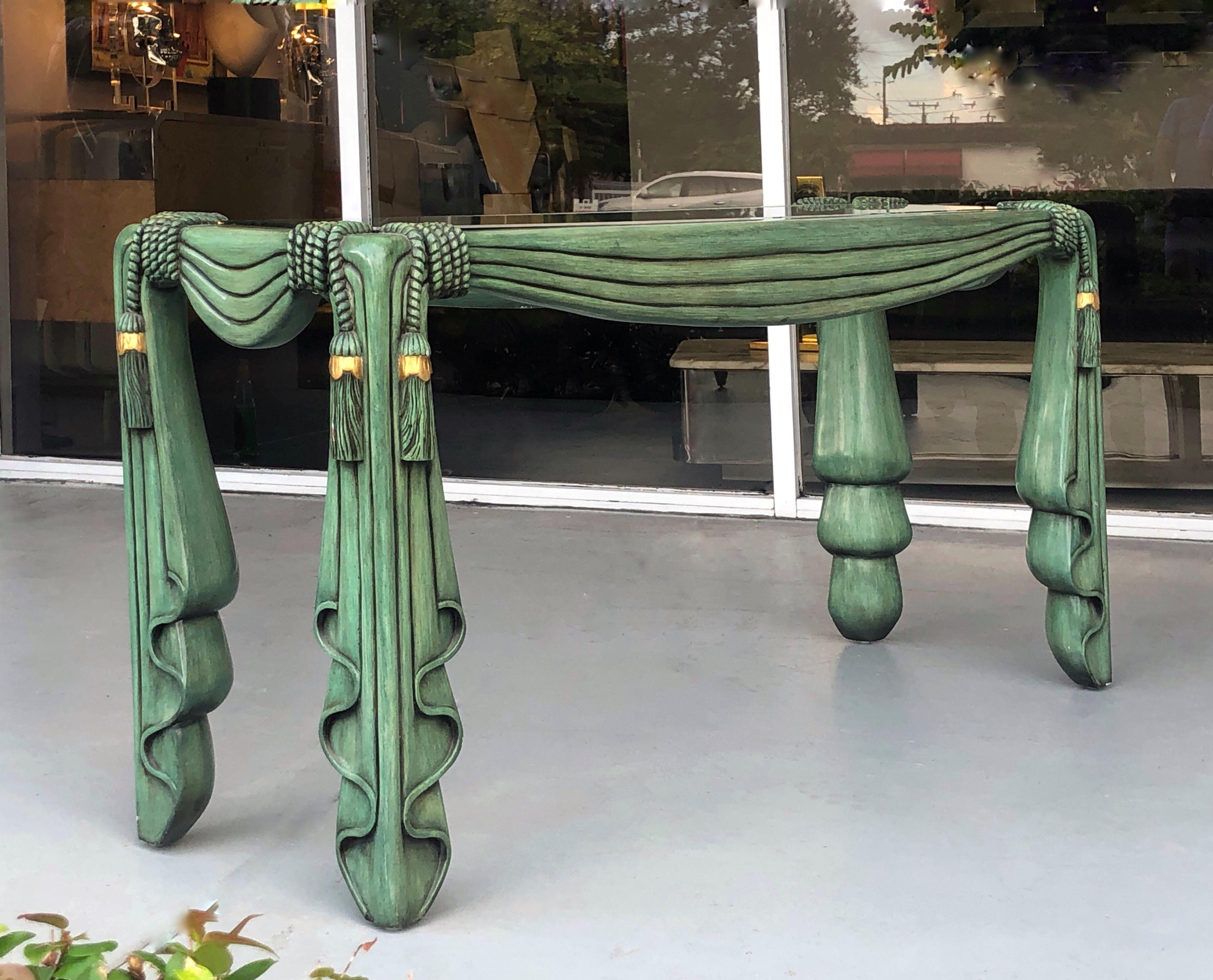 This is a beautiful console table. The drape and tassel design is hand carved wood with a hand painted finish. Beveled glass top.