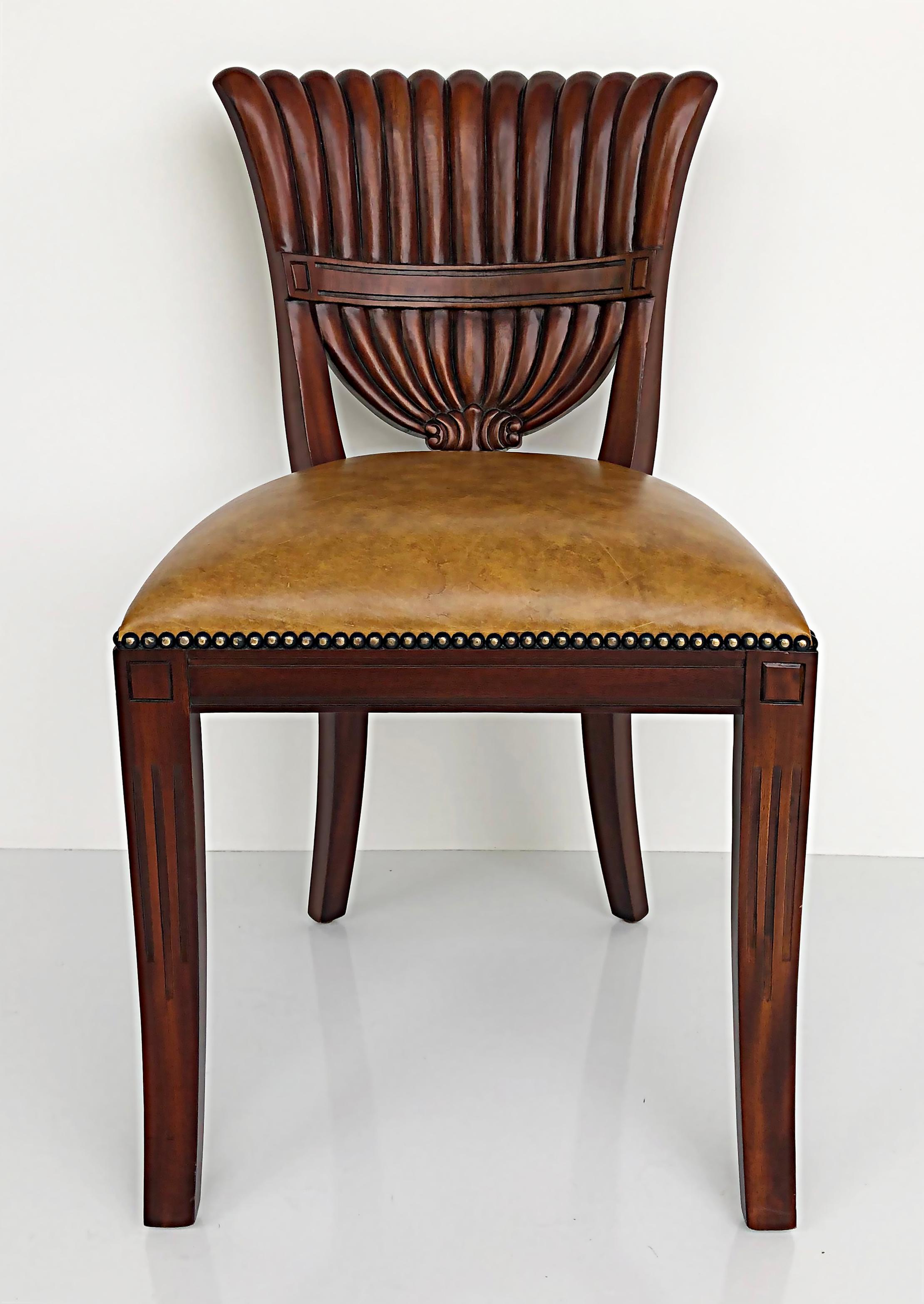 Maitland Smith carved wood side chairs, nailhead detail trim, pair.

Offered for sale is a pair of elegantly carved wood side chairs from Maitland-Smith. The chairs are marked as shown. They are upholstered in Naugahyde and have nailhead detail