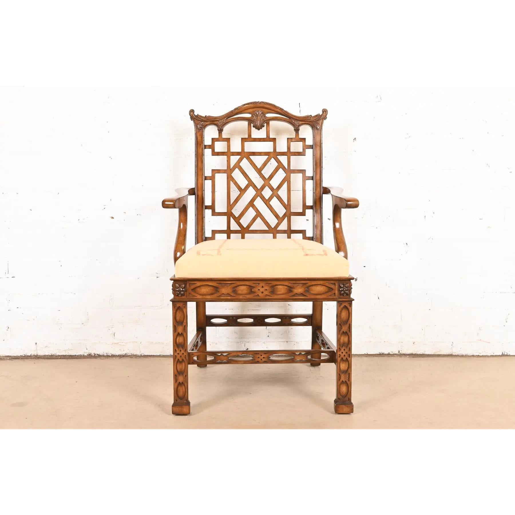 A gorgeous Chinese Chippendale or Hollywood Regency Chinoiserie armchair or dining captain chair

By Maitland Smith

Circa Late 20th Century

Carved mahogany, with Asian-inspired design, and upholstered seat.

Measures: 25.75