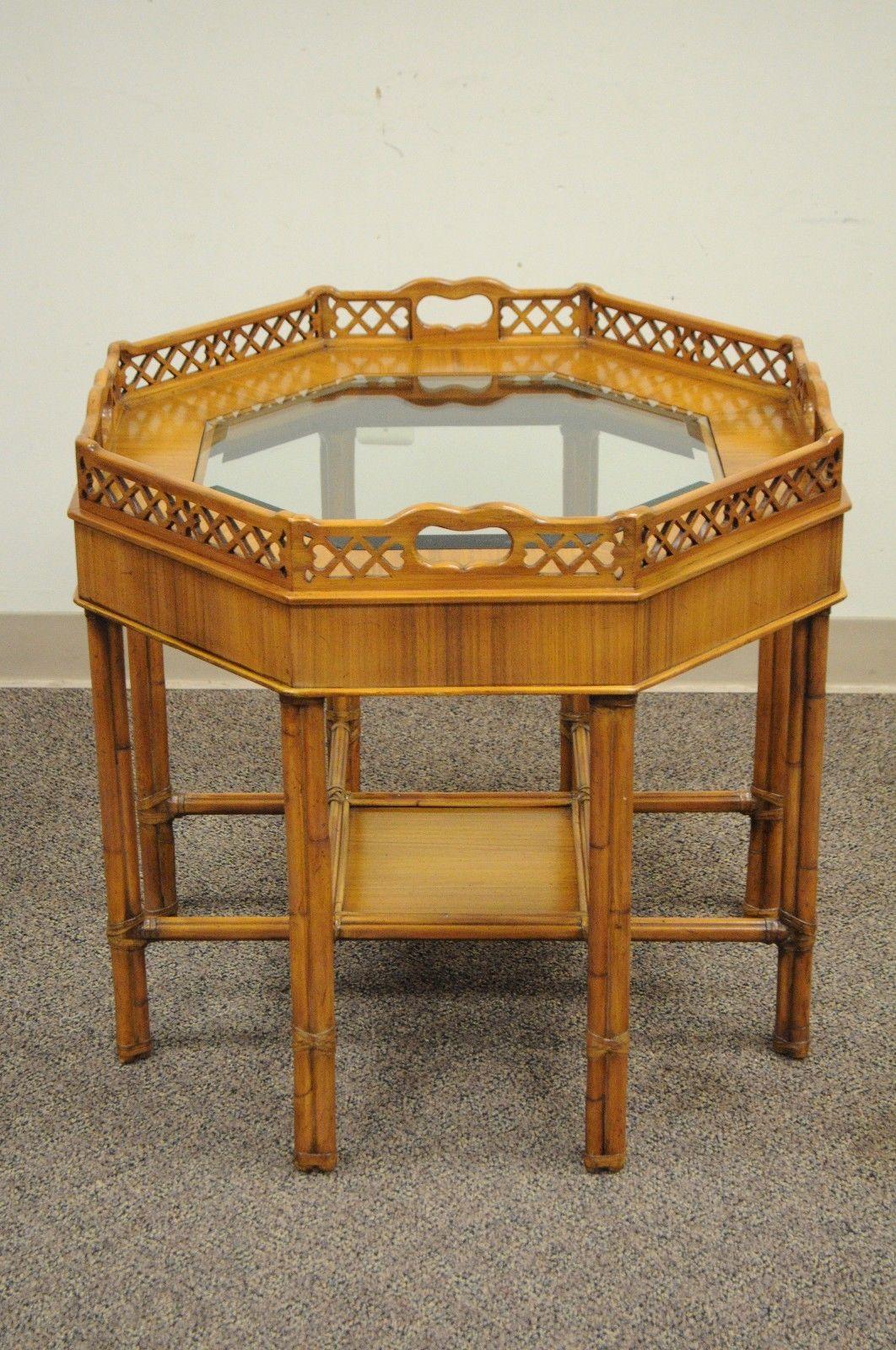 Maitland-Smith Chinese Chippendale style mahogany octagonal end table. Item features octagonal Mahogany wood faux bamboo or rattan style frame, octagonal bevelled glass inset top, lower shelf, stretcher base, and original label, circa late