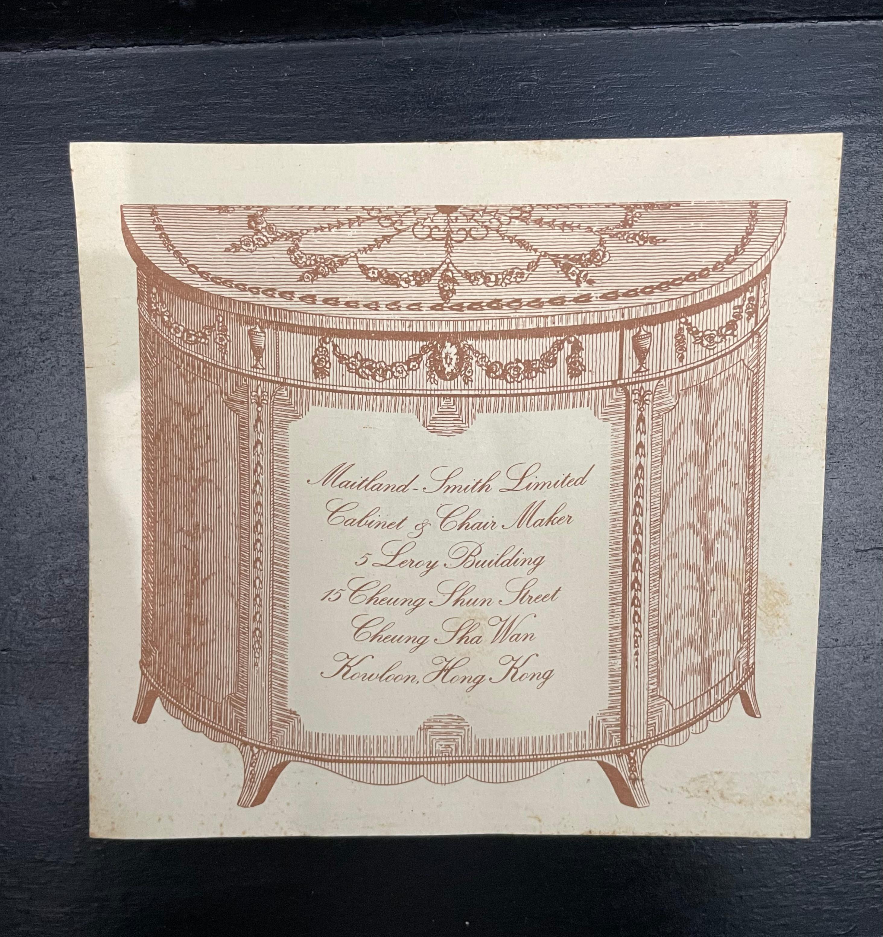 This stylish and chic Maitland Smith piece is very much in the manner of a tea chest/trunk on stand.  The piece is fabricated in wood with a lacquer finish, detailed  with raised chinoiserie scenes. 

Note: The piece retains its Maitland Smith paper