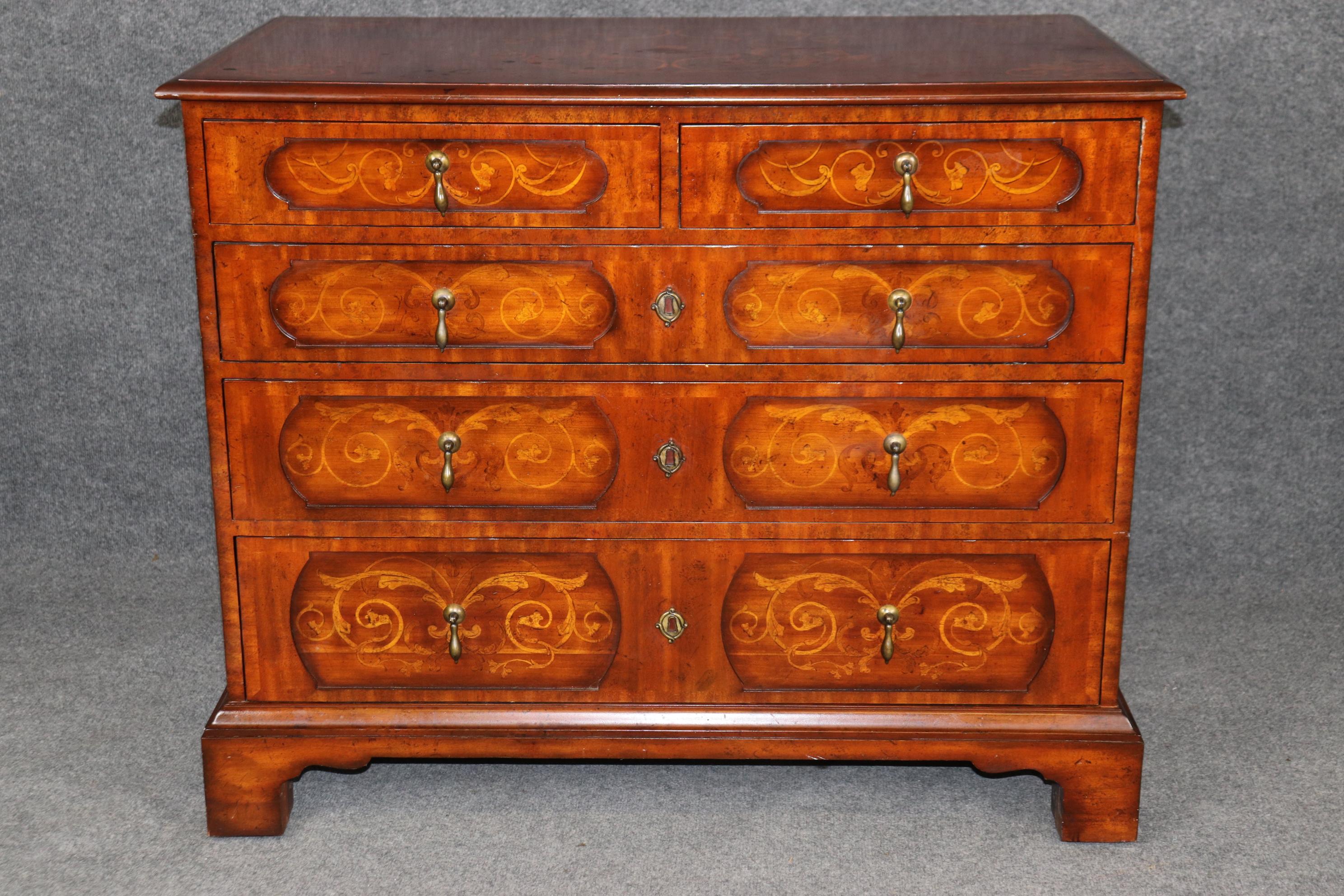Dimensions - H: 33 1/2 in W: 40 1/2 in D: 22 3/4 in 

A stunning Maitland-Smith Chippendale William and Mary-style five-drawer commode, expertly crafted to embody the elegance and refinement of 17th-century English design. This exquisite piece