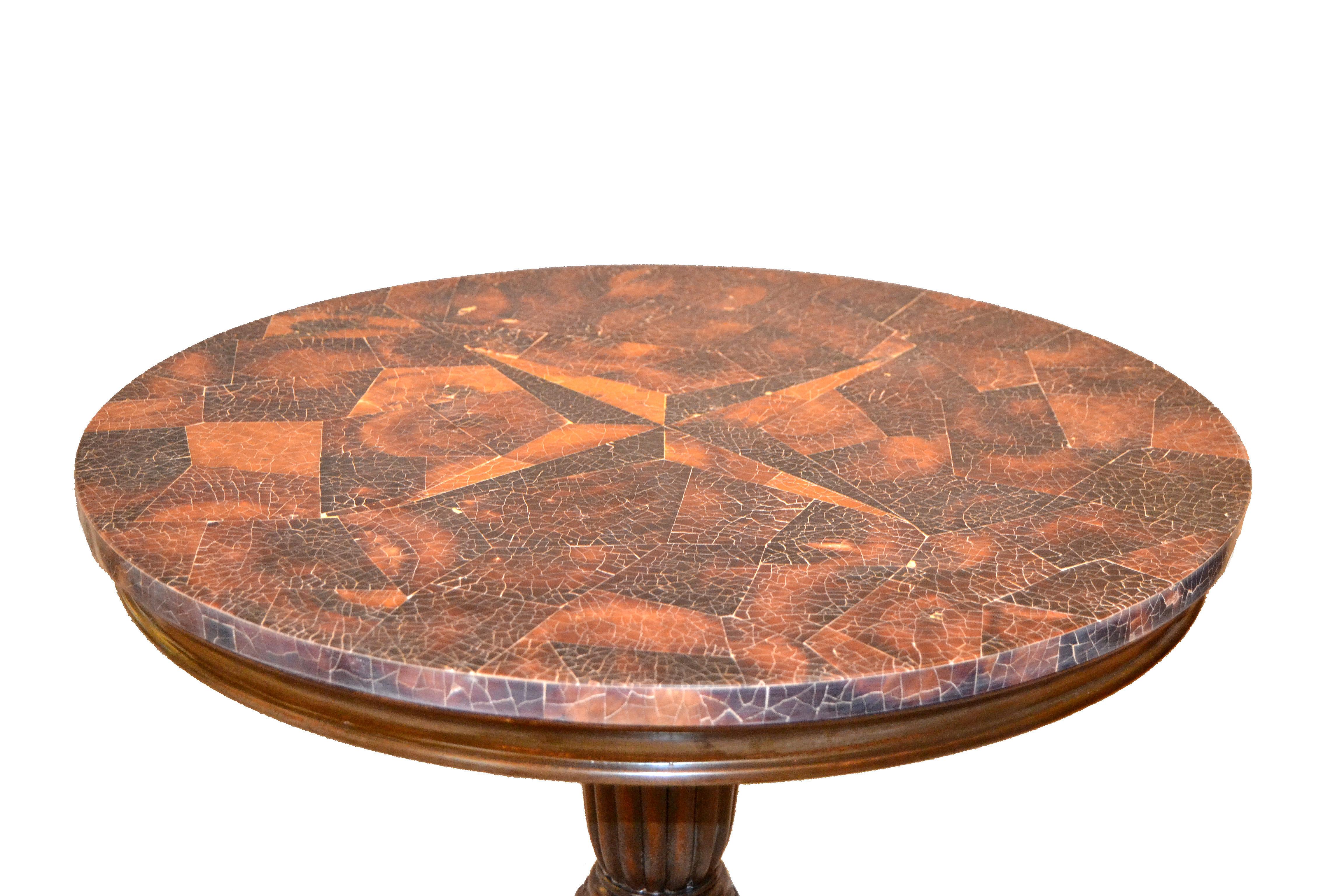 Great Maitland-Smith round coconut and hand-carved wood accent side table.
The top is created with pieces of coconut in a stunning manner.
The stem is hand-carved wood supported by a sturdy base.
It is marked underneath with made in the