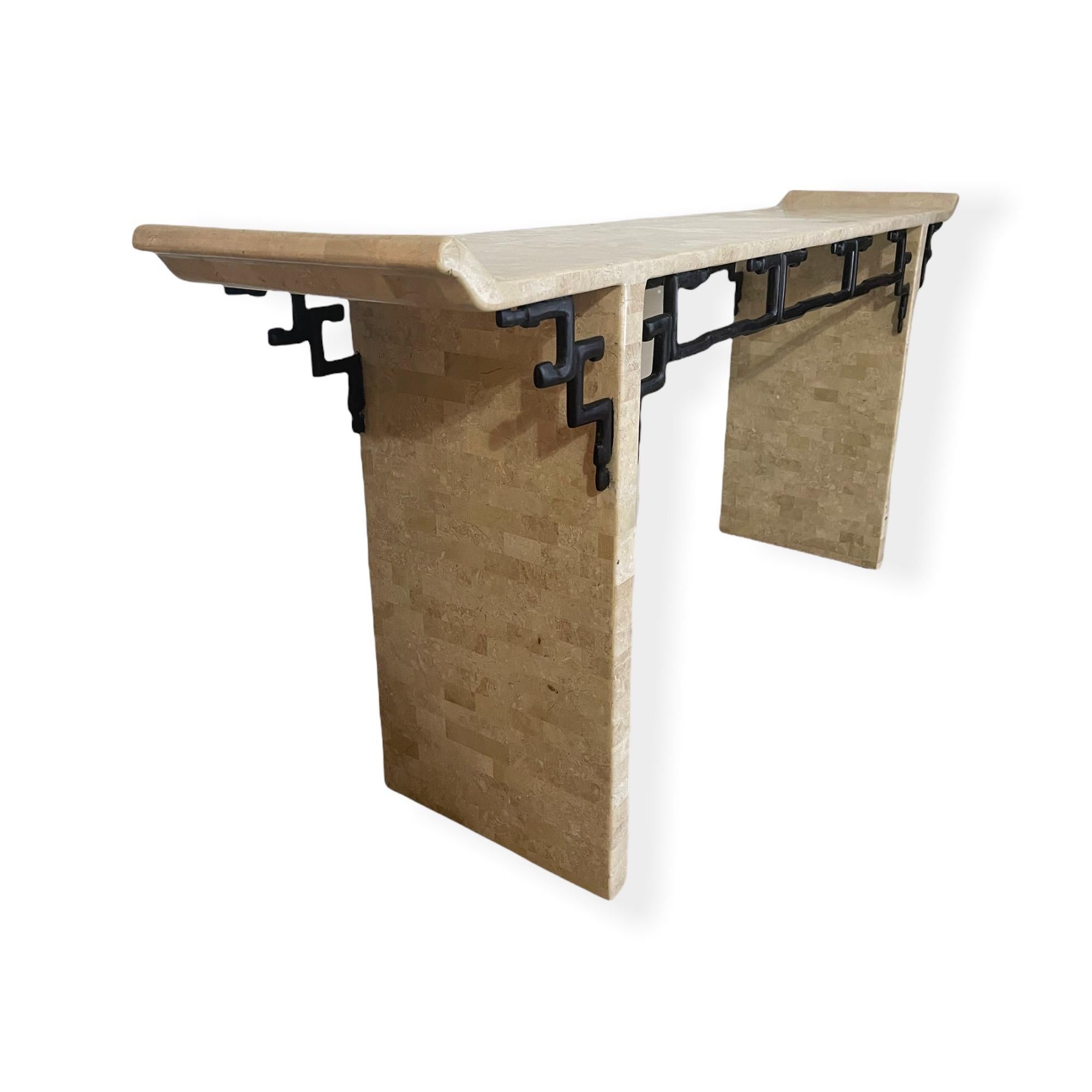 Beautiful 1970s Maitland Smith console table. The table is made of some sort of Travertine stone or marble and has a beautiful decoration along the sides. This piece is in good vintage condition with normal wear consistent with age and use.