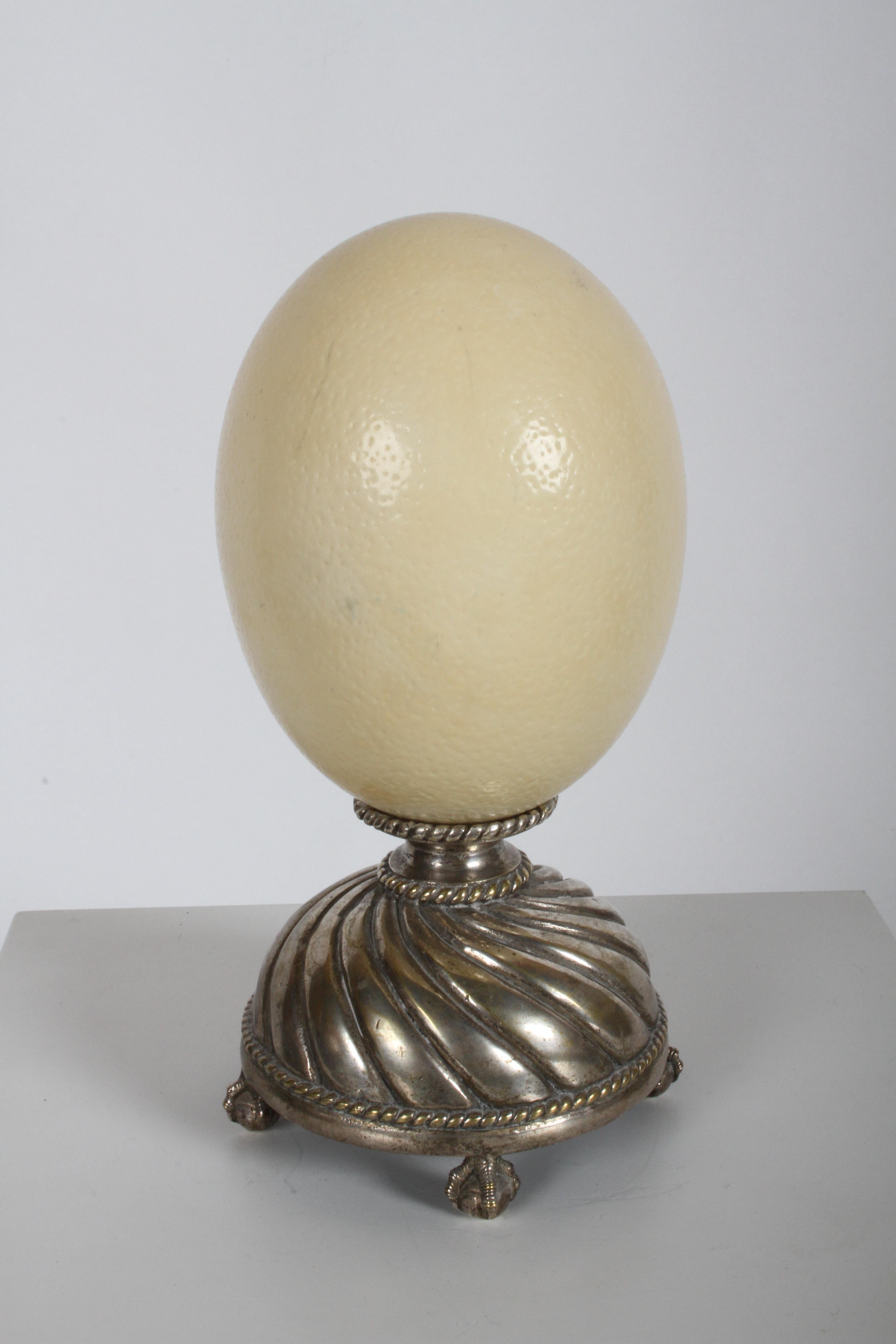 Maitland-Smith decorative real ostrich egg on bilverplate base with ball and claw feet, circa late 1970s or 1980s. Label. Wear to silver plate, light discoloration to Ostrich Egg. No cracks or breaks.