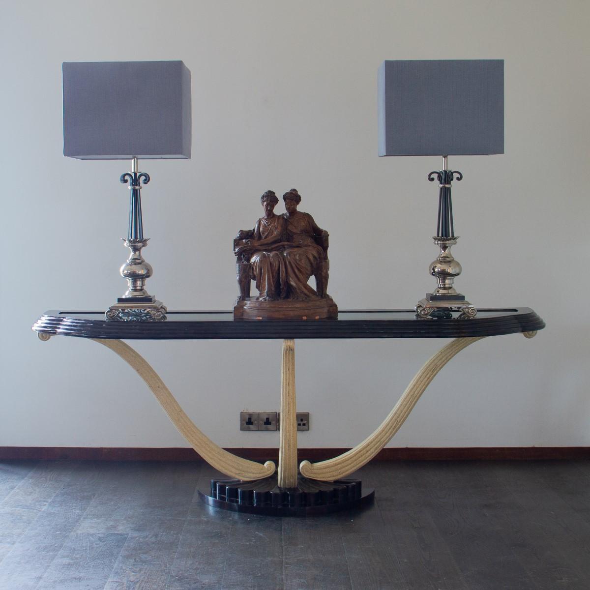 A rare Maitland Smith designed tortoiseshell veneered console table with three painted cabriole supports set on a fan shaped base. The top has a stepped finish and an inset glass top, 1980s

Maitland Smith was established in 1979. They used highly