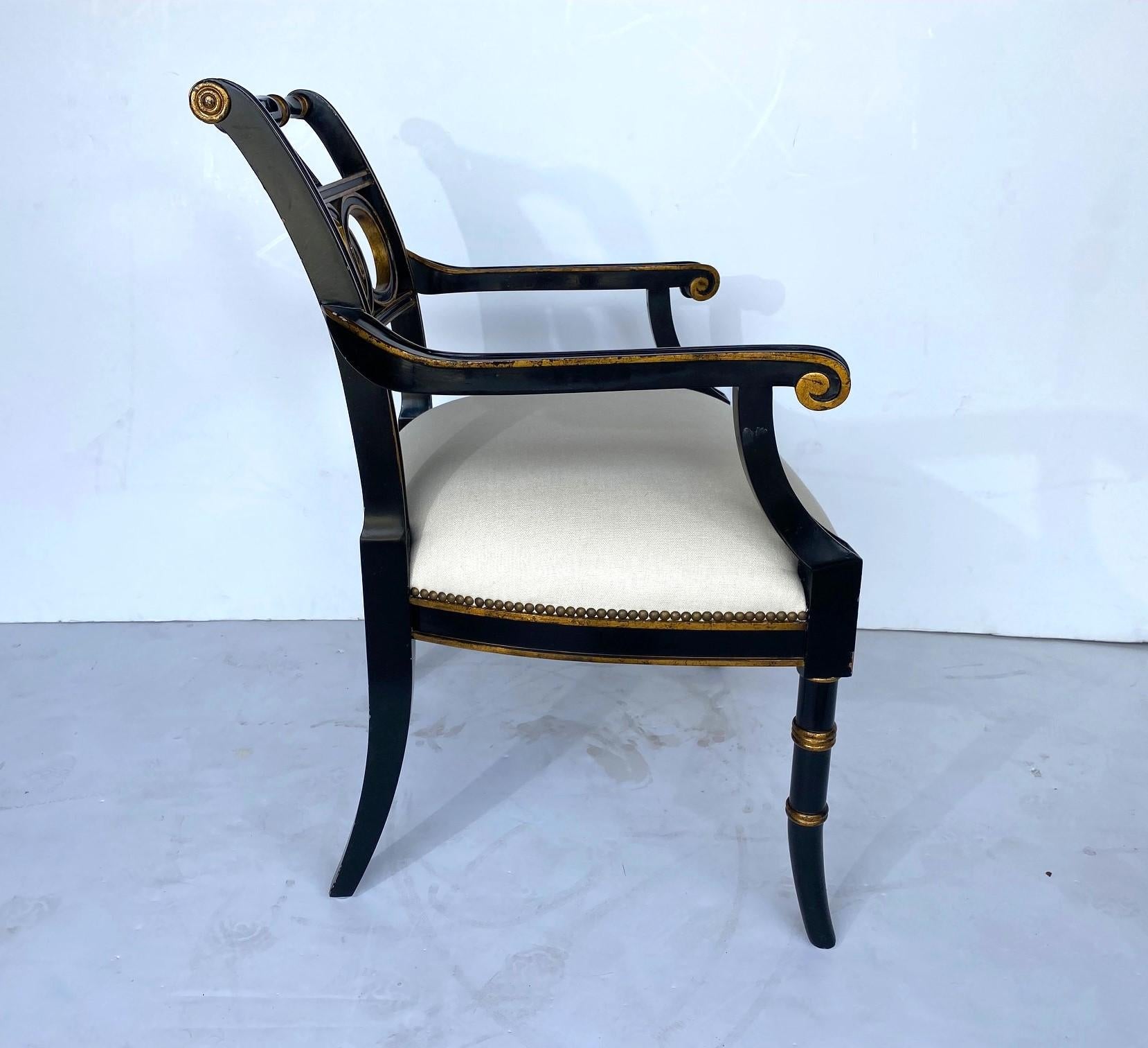Maitland Smith Ebonized and Gold Gilt Regency Style Armchair. New upholstery. Arm 26.50