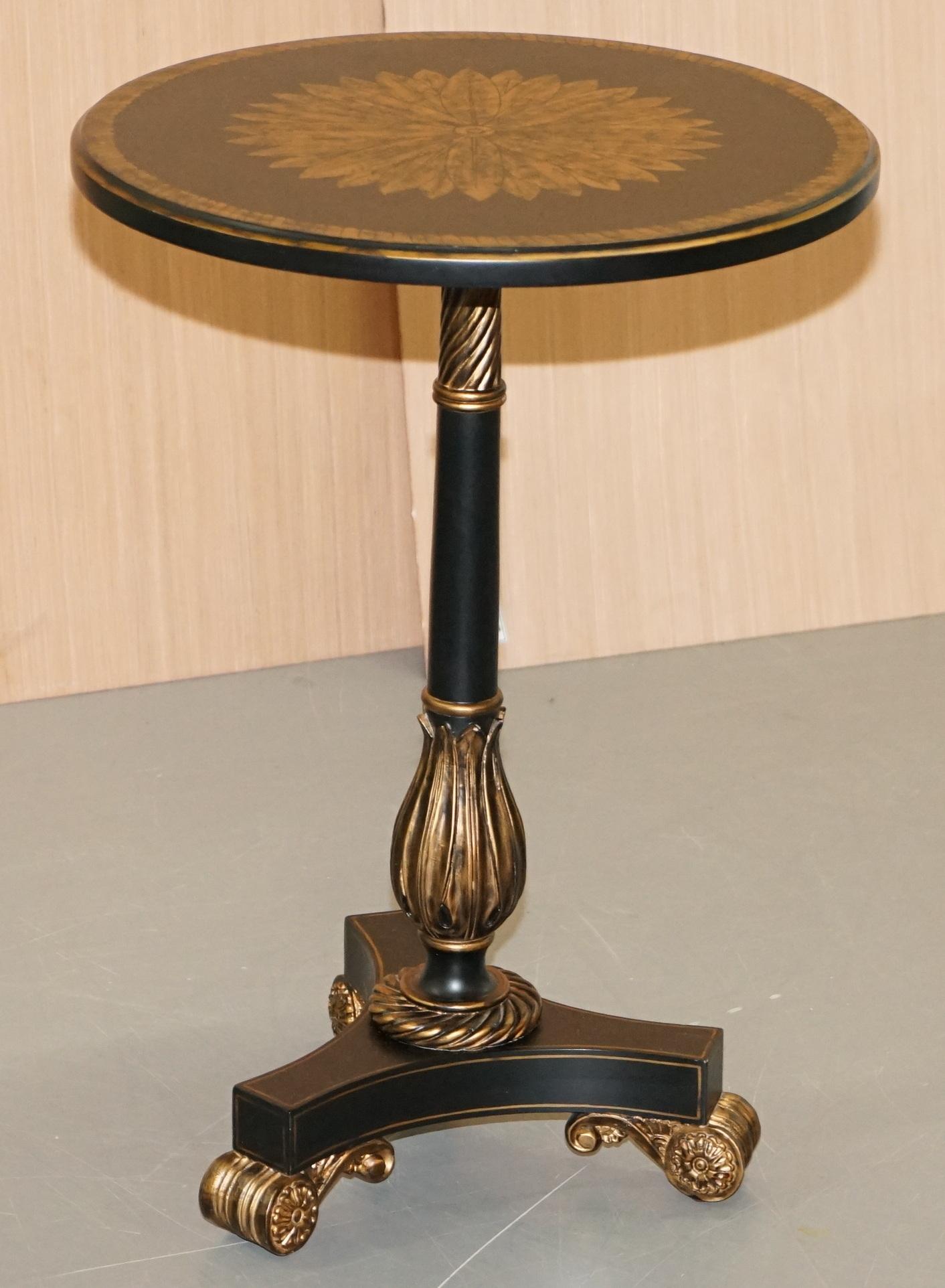 We are delighted to offer for sale this lovely ebonised black with Sun burst gold occasional lamp table by Maitland-Smith

A very good looking and decorative table, designed as a lamp or wine table, the gold leaf detailing is sublime in the right