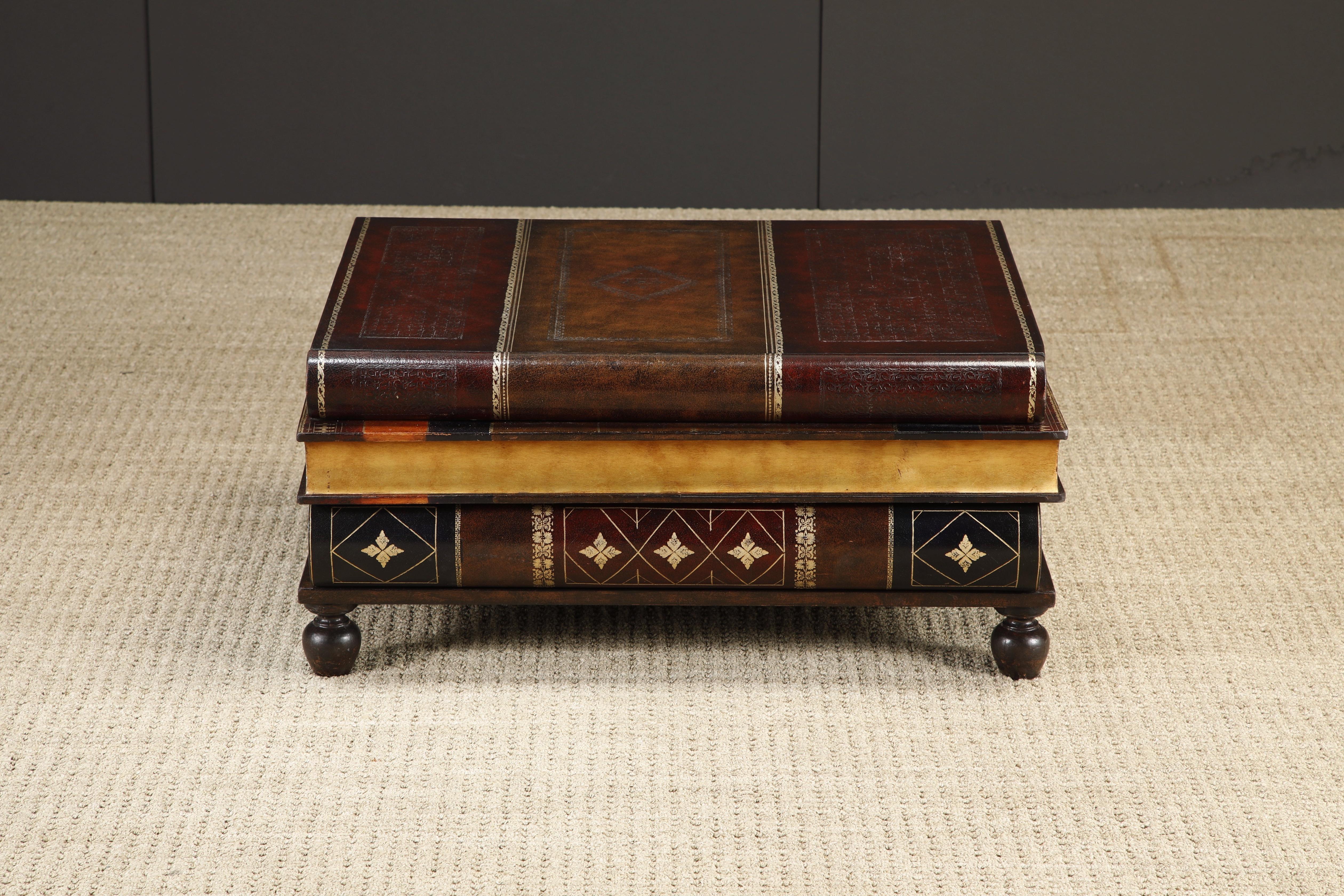 Impressive trompe-l'œil leather book coffee table by Maitland Smith, circa 1990, that would make a fantastic conversation starter for any space. The whimsical table's surface is made up of one large antique looking hardback book stacked on top of