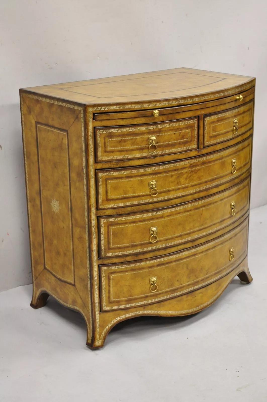 Maitland Smith English Georgian Style Leather Wrapped Bow Front Chest of Drawers. Item features a beautiful tooled leather case, solid brass hardware with lion head drop pulls, pull out surface, and 2 over 3 drawers, quality Maitland Smith
