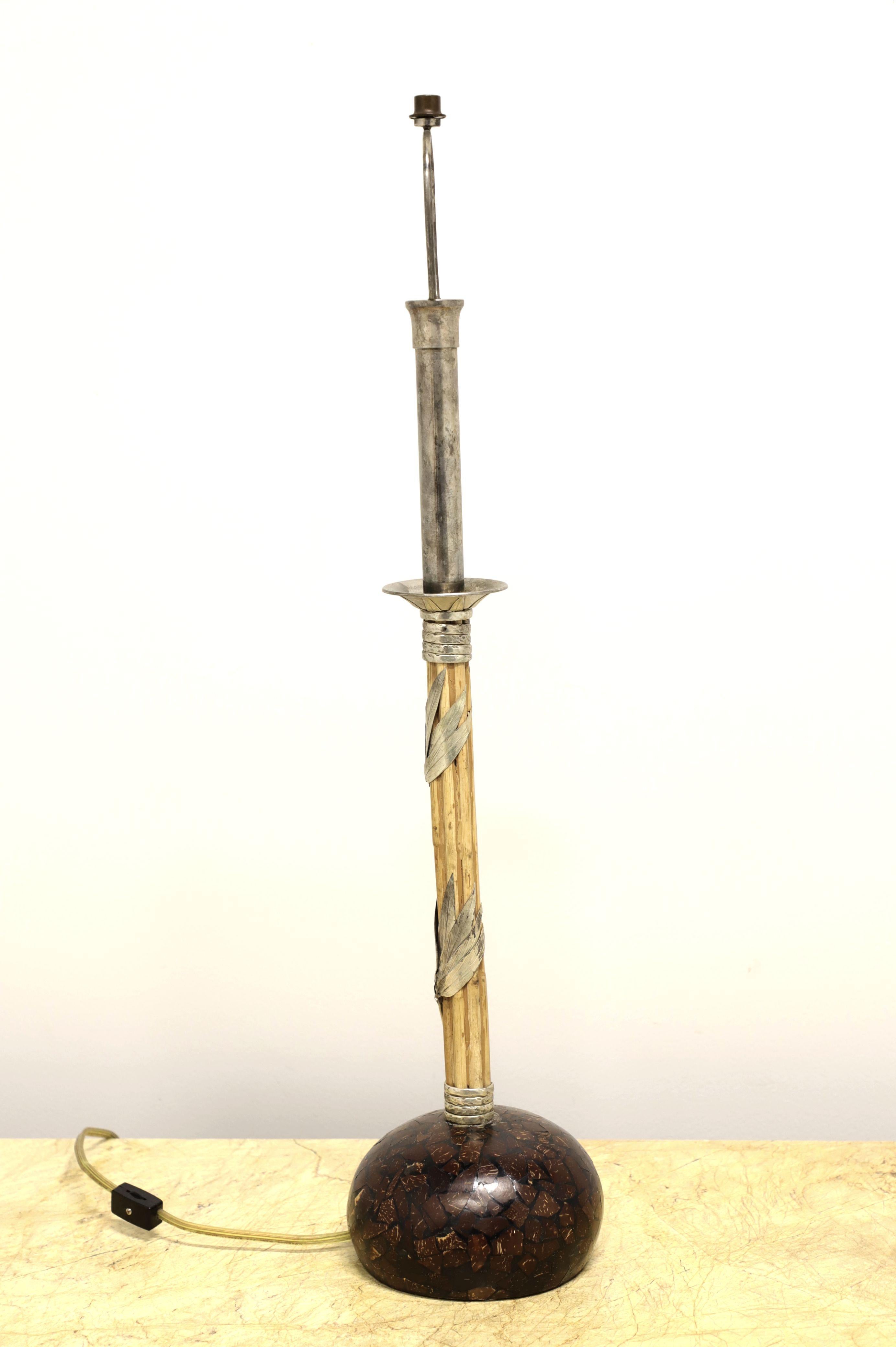 A Contemporary style candlestick table lamp by Maitland Smith. Tessellated lucite base, bamboo wrapped with decorative silver metal candlestick shaft and silver metal neck. Has a fixed metal harp with finial. Single standard bulb socket and toggle