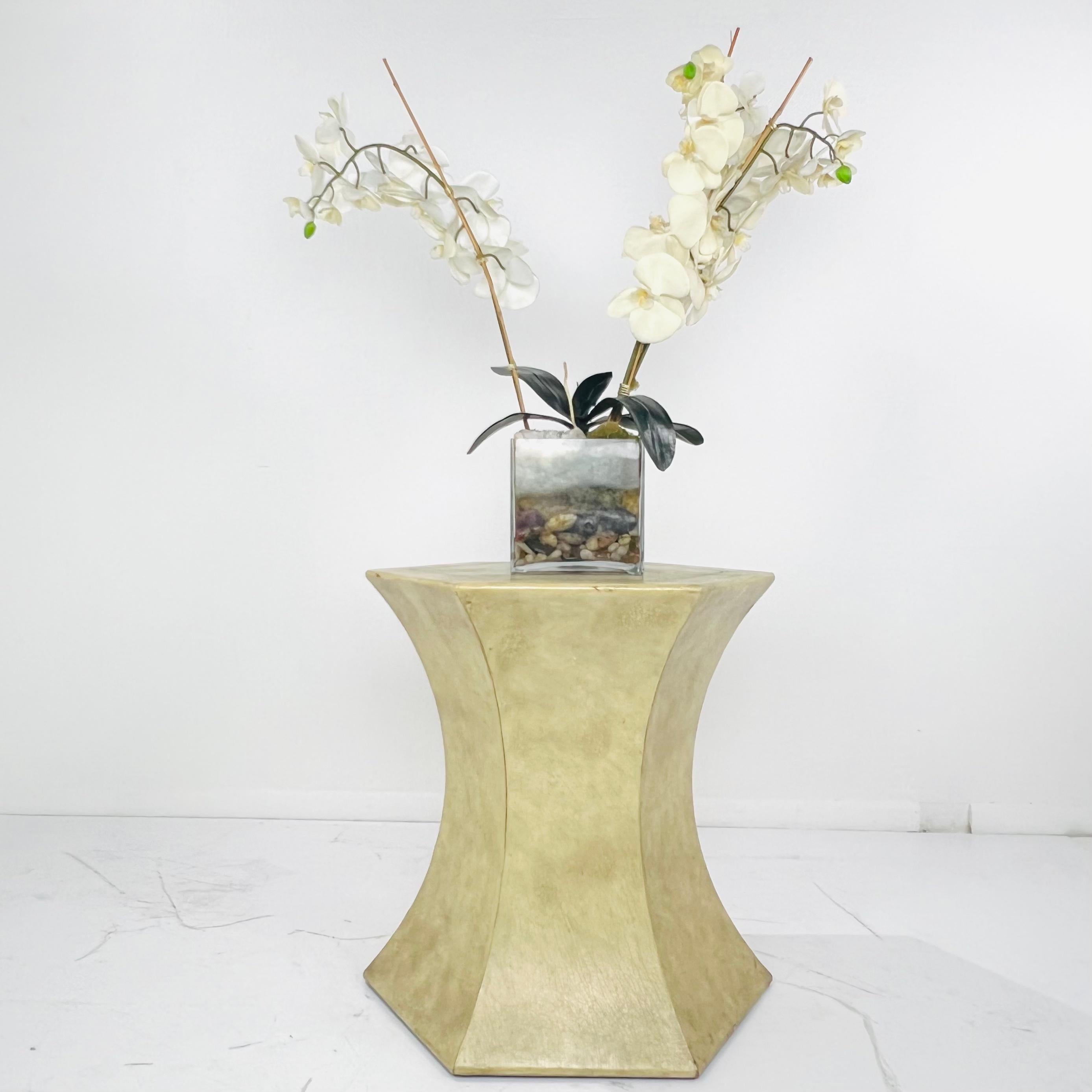Elegant, classic Maitland-Smith glazed leather pedestal with faux elephant hide finish and gold embossed details. A handsome statement in both traditional and modern settings. Good sturdy vintage condition with some cosmetic imperfections including