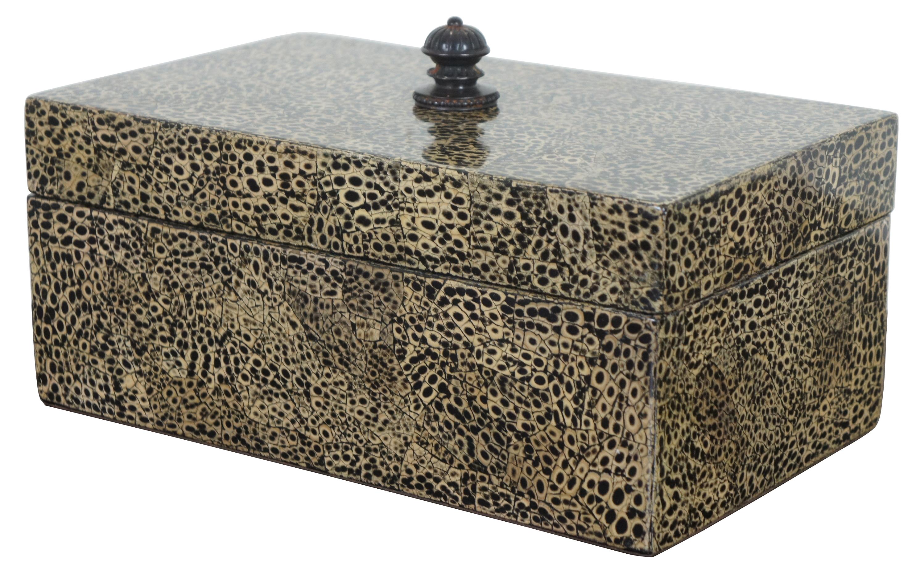 Beige and black faux shagreen snakeskin style trinket box with lacquered finish and black interior by Maitland-Smith. Measures: 12”.
  