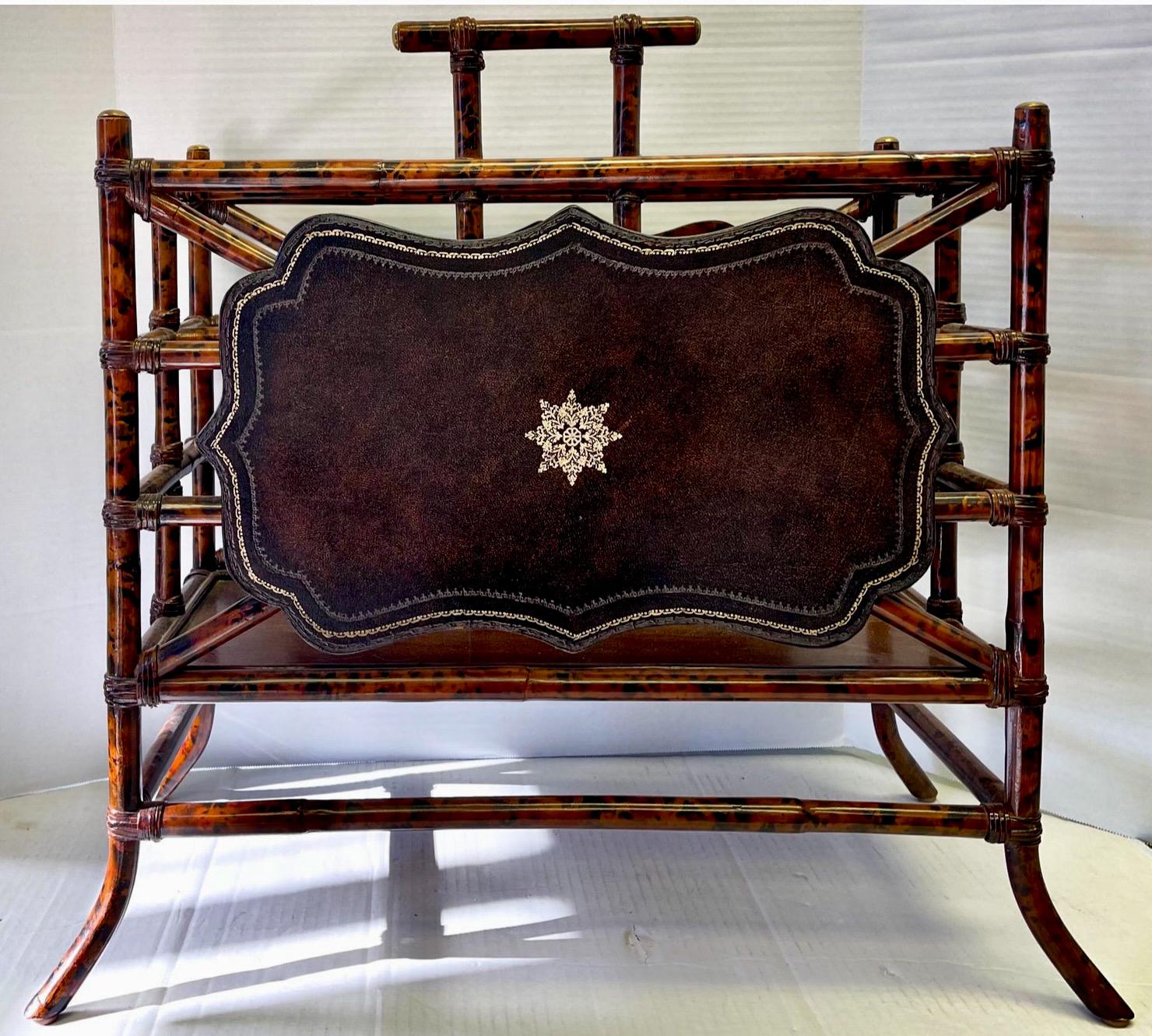 This is a good looking Maitland-Smith faux tortoise and tooled leather bamboo magazine rack. It is marked and in very good condition.