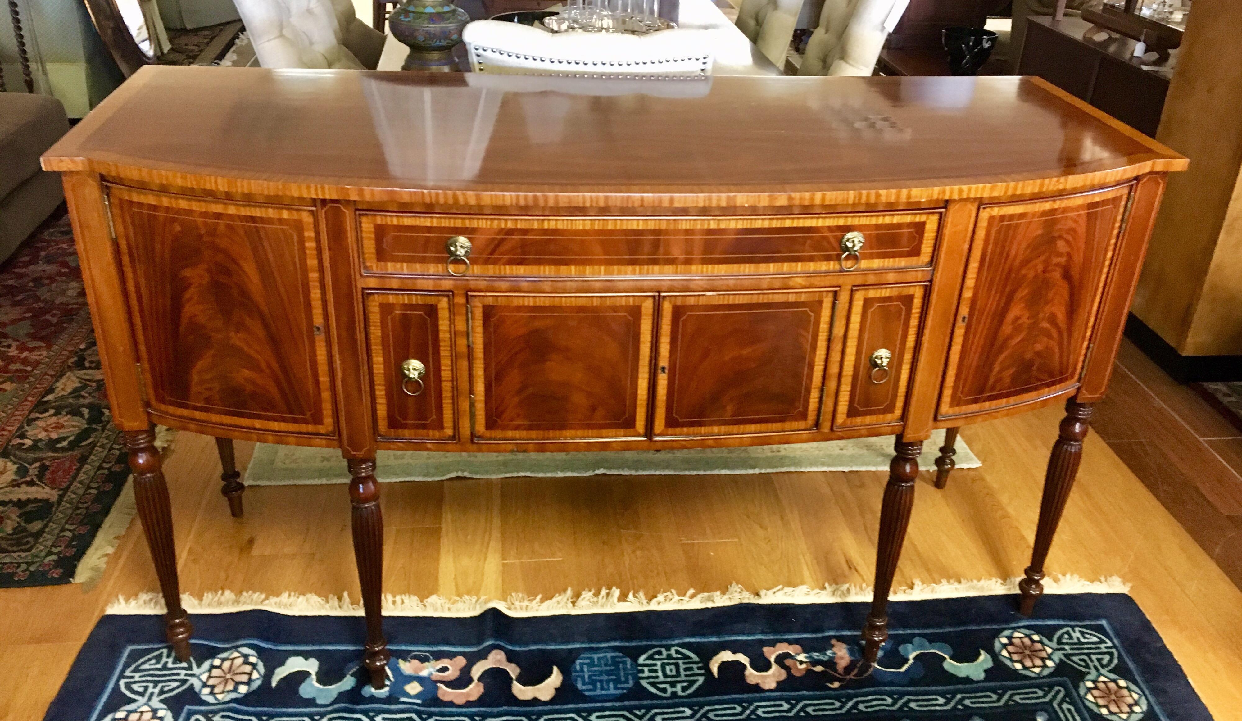 Signed Maitland Smith flame mahogany sideboard/buffet/server with multiple drawers, compartments and brass pulls.
Comes with key to lock drawers. Inlay throughout is gorgeous.