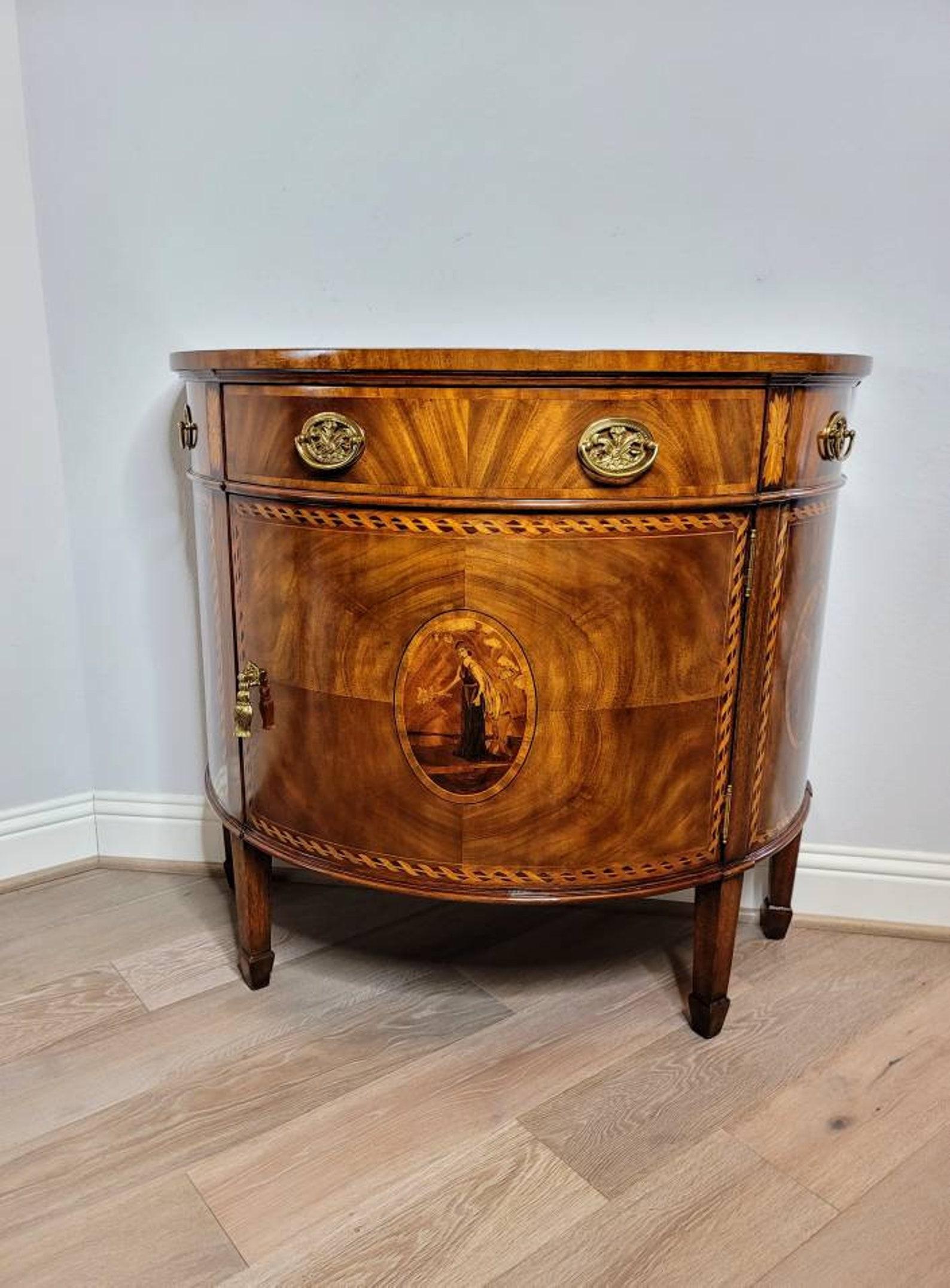 A richly decorated bow front chest by very fine quality American designer Maitland-Smith. Handcrafted in luxurious Louis XVI taste. 

Visually striking flame mahogany panels, exquisite marquetry-work, with a cross-banded highly figured top and