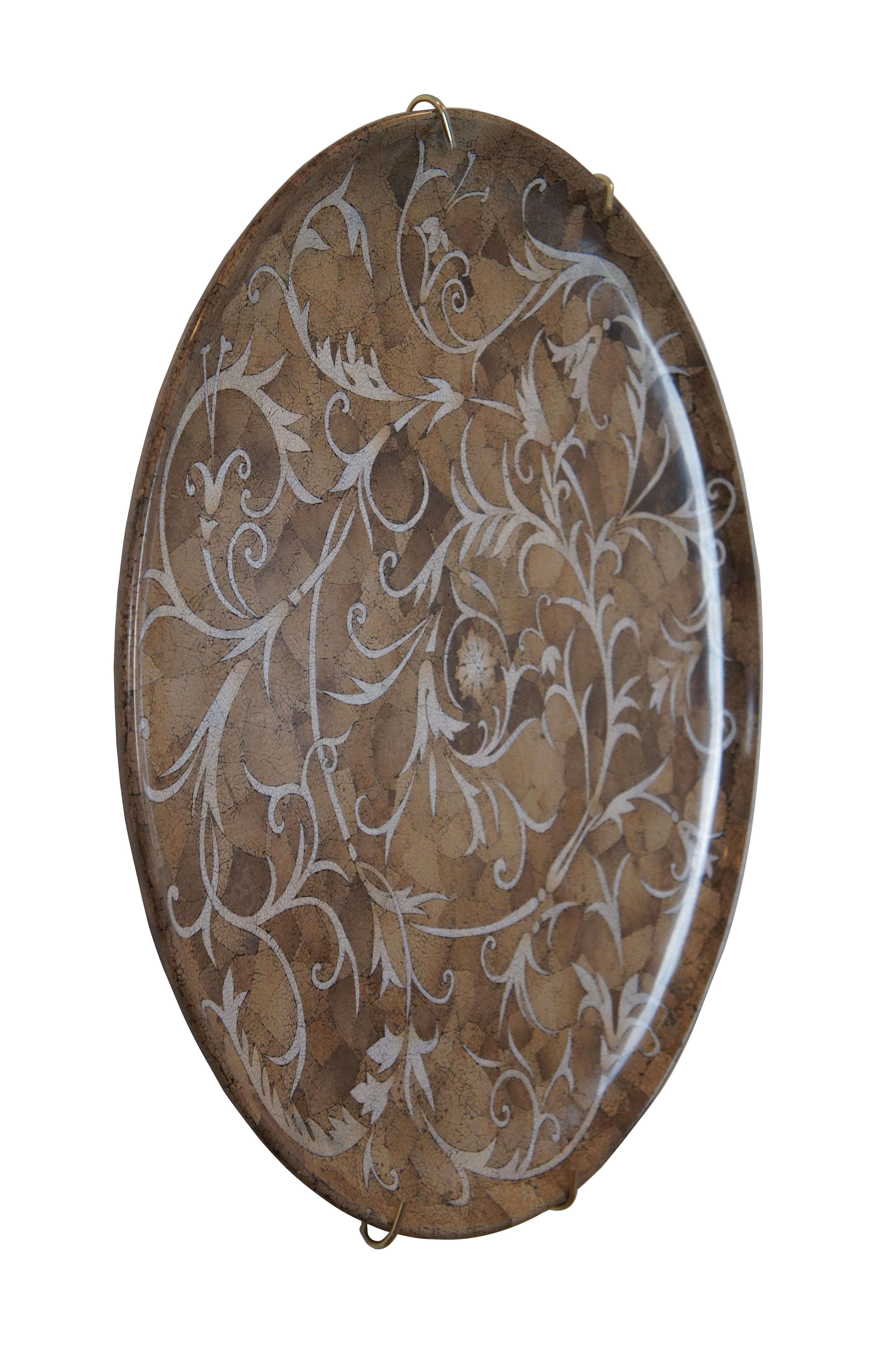 A rare Maitland Smith over sized round Charger / platter / tray featuring a lacquered floral mosaic pattern in shades of brown and white. Includes support for wall hanging.