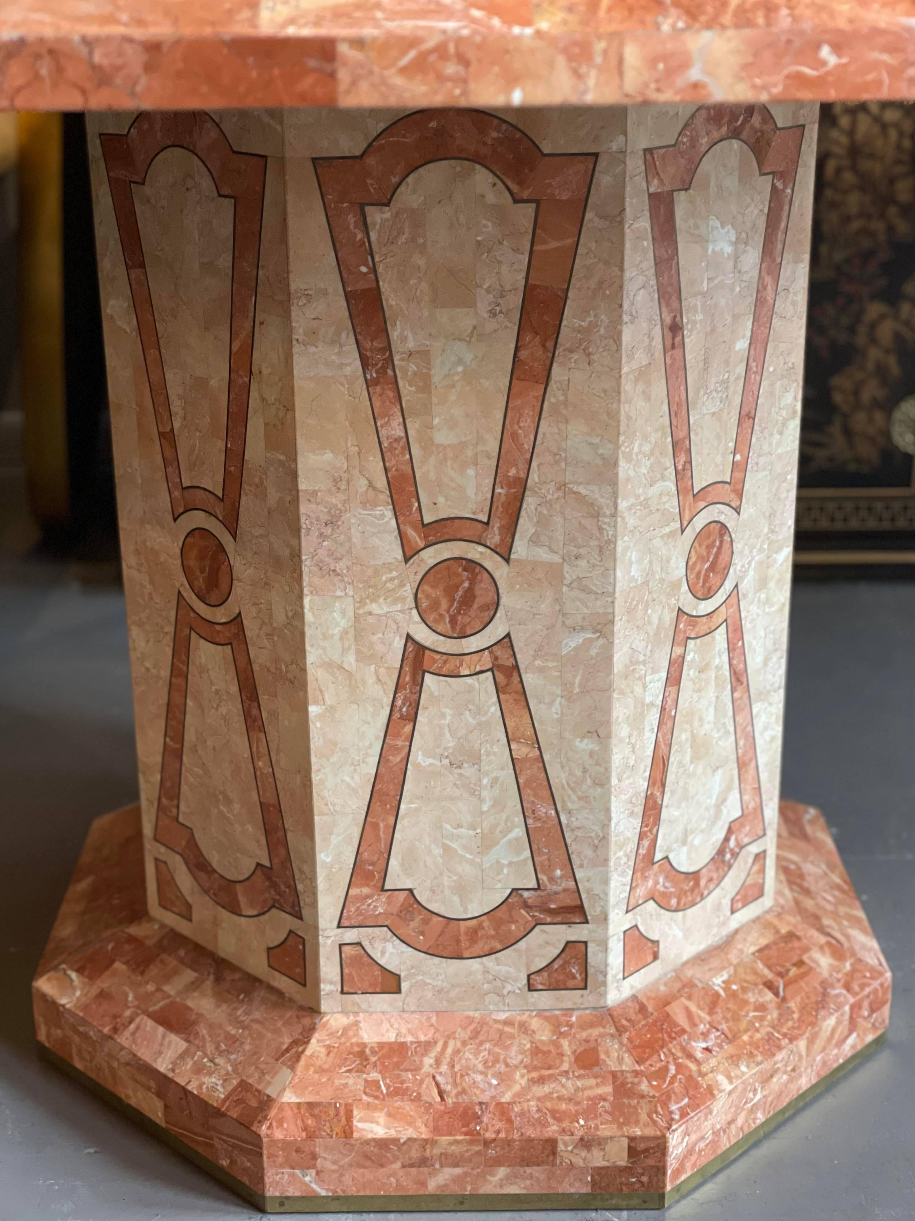 Absolutely stunning dining table from the 80s. It is made of tessellated fossilized coral in a beautiful floral pattern. The colors are beige and salmon. The original owner (a furniture dealer) bought this for his personal home from the