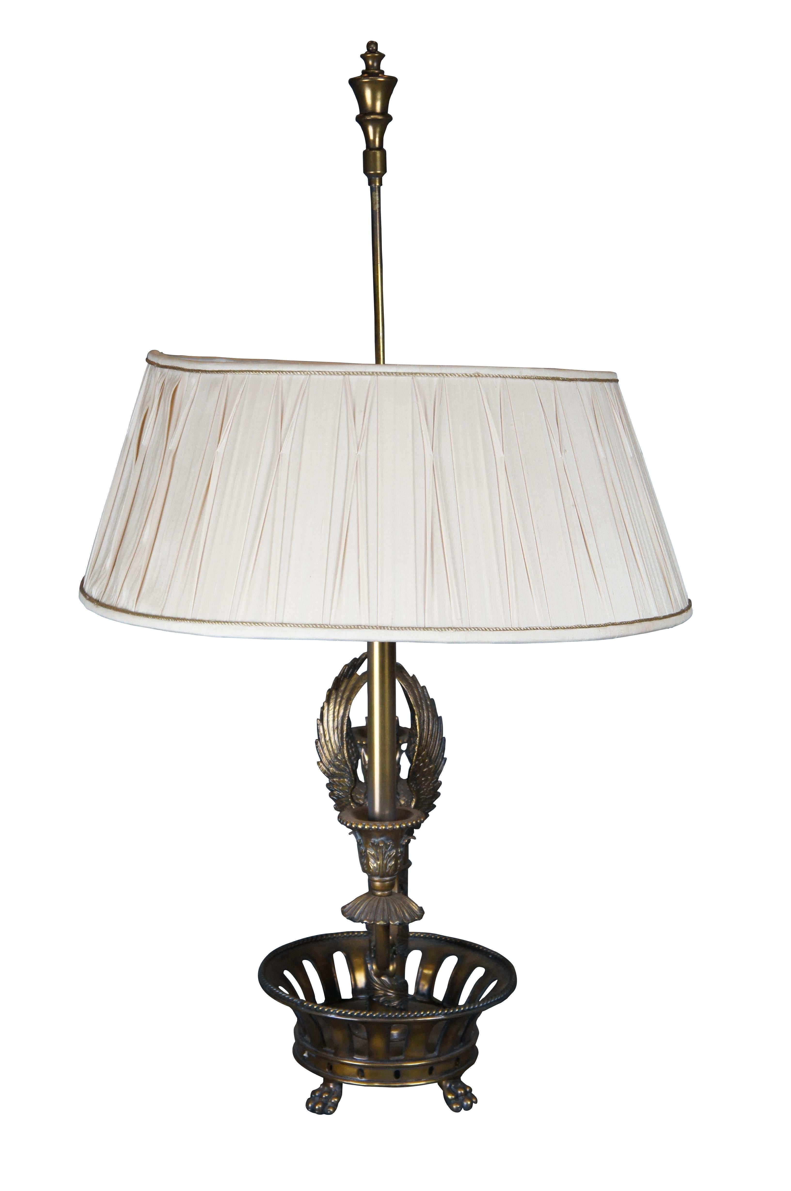 Monumental late 20th century Maitland Smith Empire style Bouillote / Budoir lamp. Made from brass with a pierced and paw footed base over an acanthus wrapped column leading to a figural winged Phoenix / Griffon candlestick center below large oval