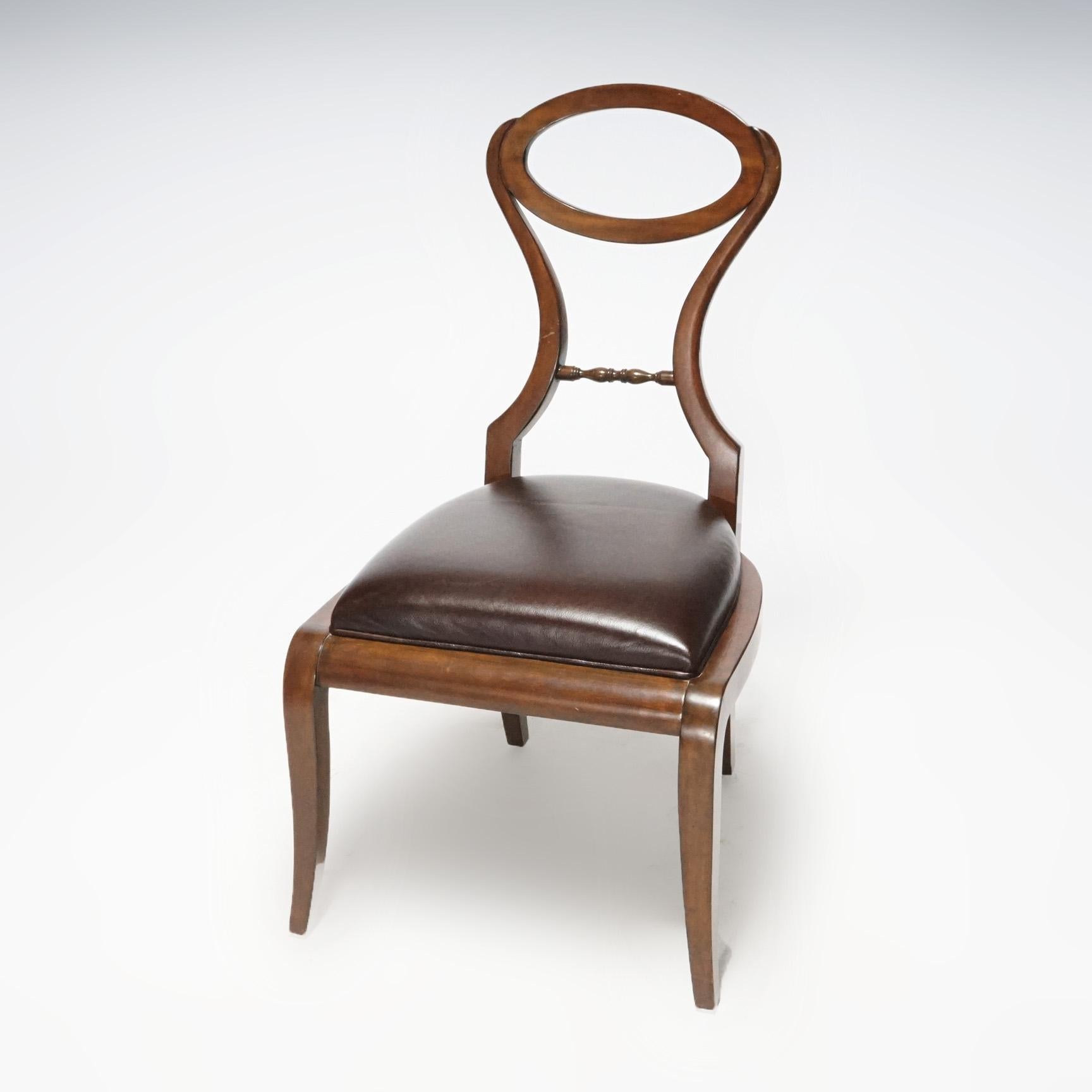 A French style side or vanity chair by Maitland Smith offers mahogany frame with stylized balloon back over upholstered seat, raised on splayed legs, maker label as photographed, 20th century.

Measures- 38.75''H x 21.25''W x 26''D.

Catalogue Note: