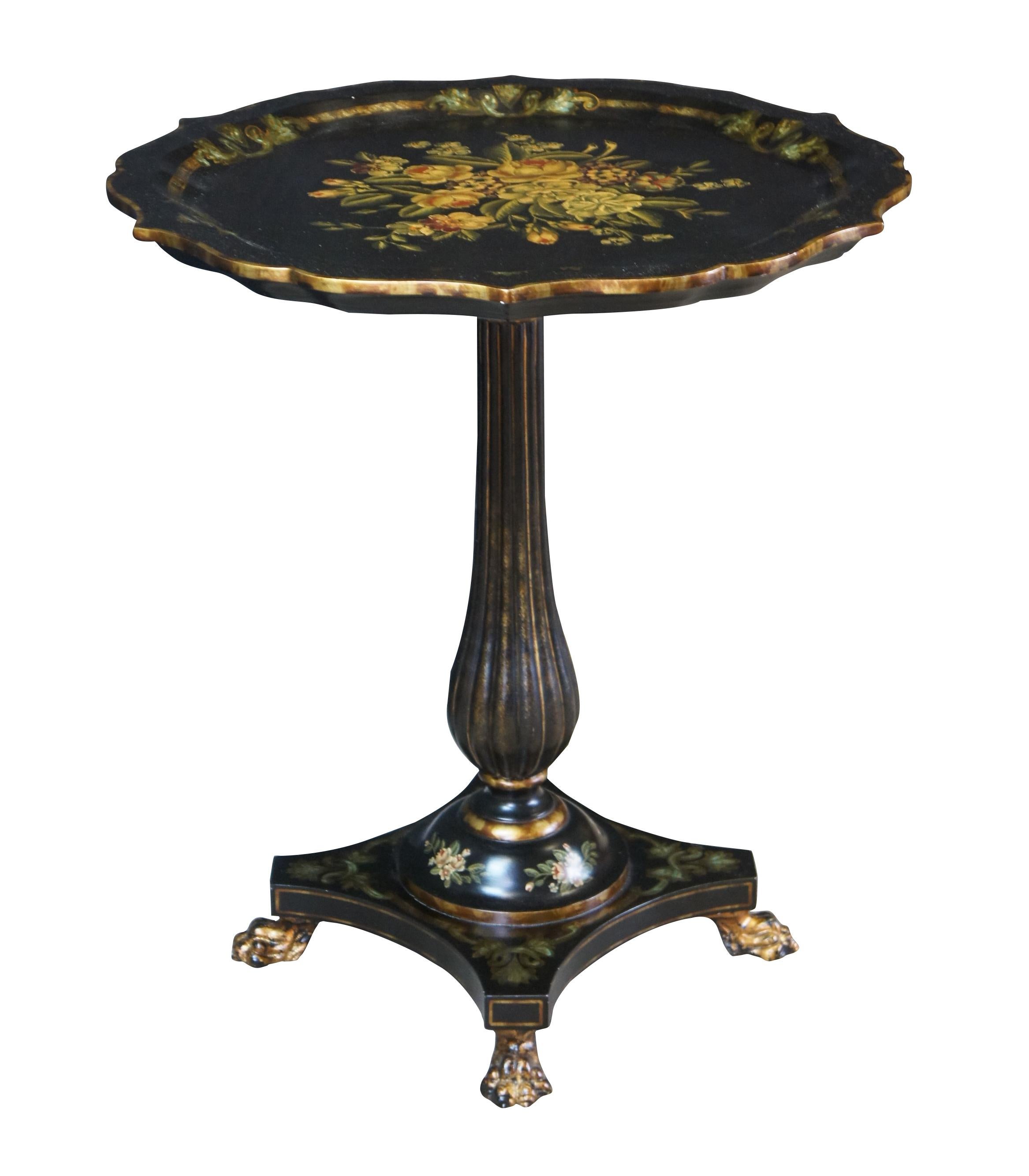 Maitland Smith ebonized pedestal table, circa last quarter 20th century.  Drawing inspiration from Victorian and French Empire styling. Features a scalloped and floral painted top over a reeded baluster leading to an iron claw foot
