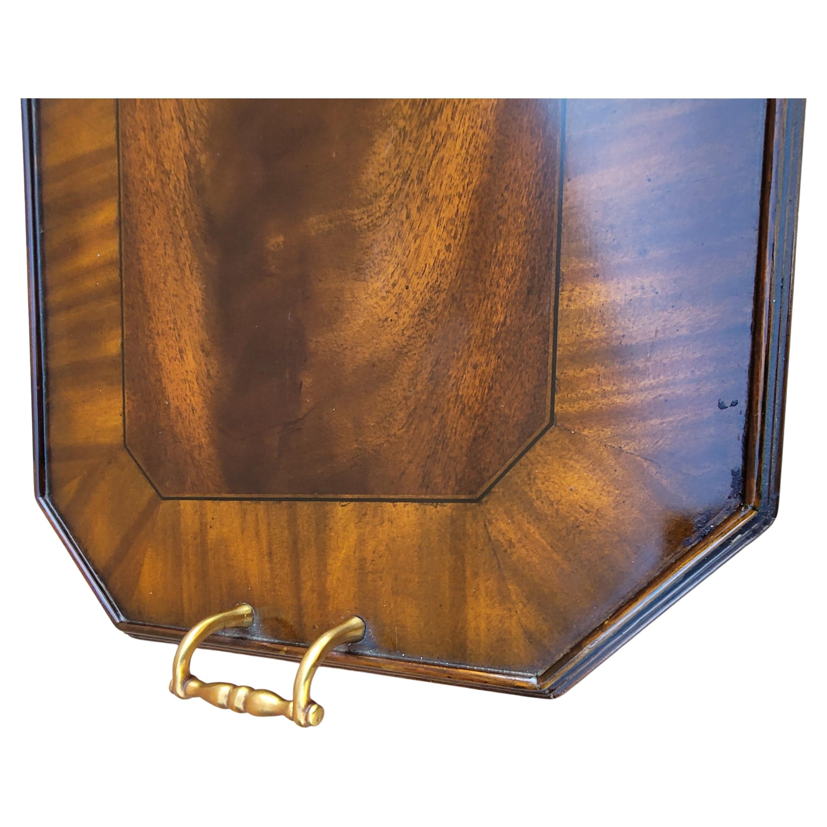 A large hand made Maitland-Smith inlaid and banded flame mahogany serving tray in George III style. Felt lined bottom to protect your tables tops. Measures 25