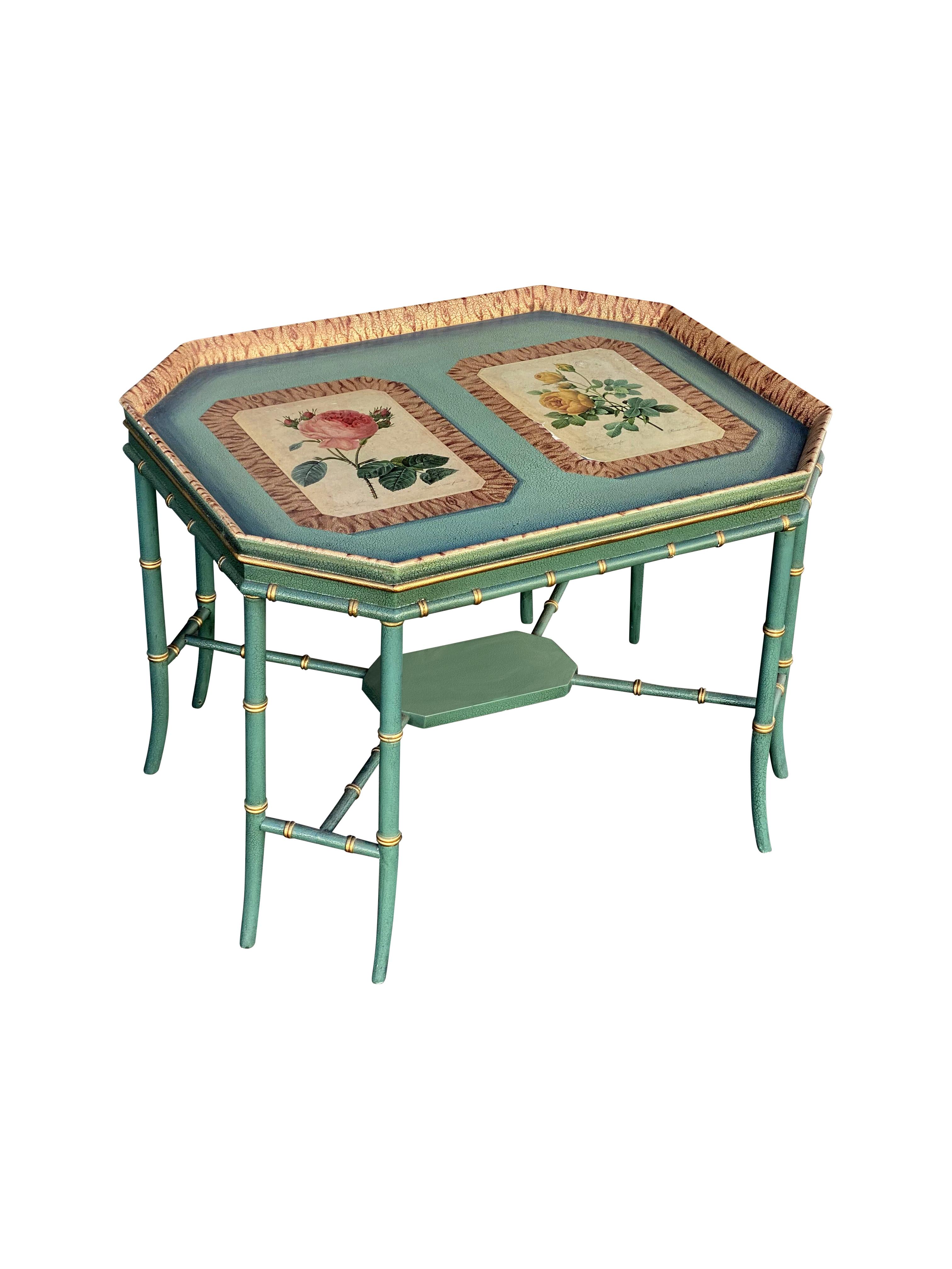 A beautiful Maitland Smith Chinoiserie bamboo tray top coffee table in painted green, gilt leaf, and embossed leather-like surface with two rose parchment illustrations on top. Overall in wonderful condition with some flakes to the illustrations but