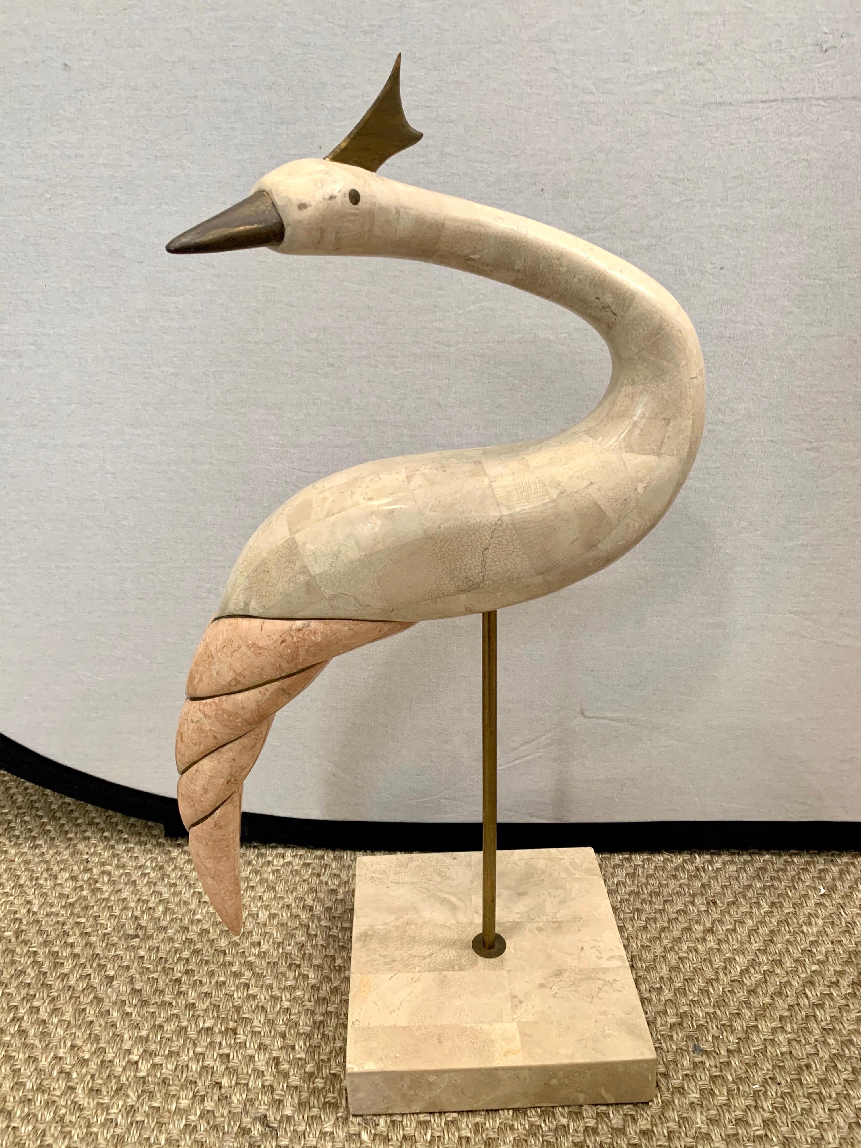 Pair of Hollywood Regency style tall crane bird sculptures by Maitland Smith composed of tessellated stone and polished brass.