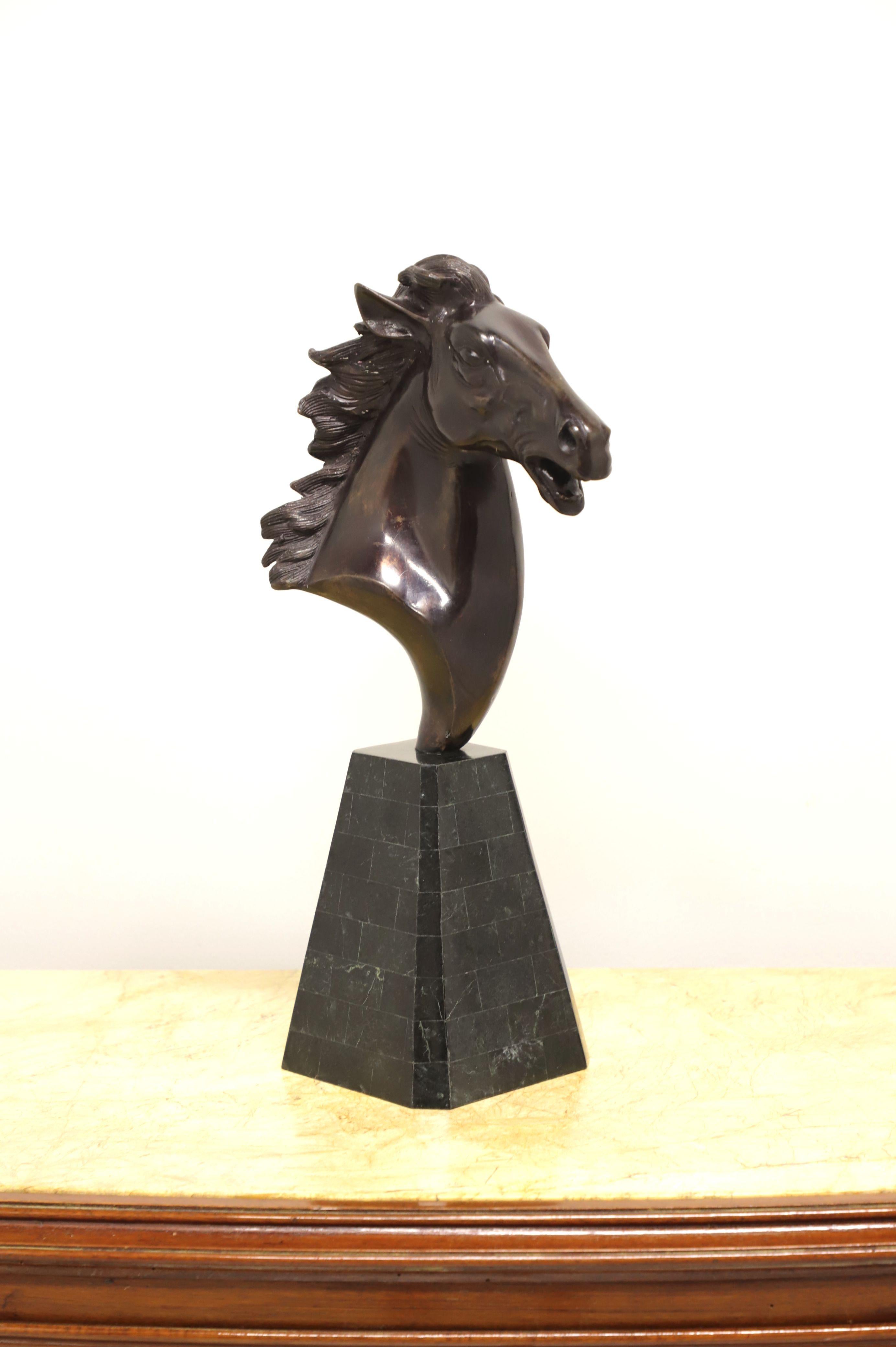 A table top sculpture in metal depicting a horse head by Maitland Smith. Sculpted metal horse head on a tessellated black marble base. Made in the Philippines, in the late 20th century.

Measures: 6.25 W 6.25 D 20.5 H, Weighs approximately: 10