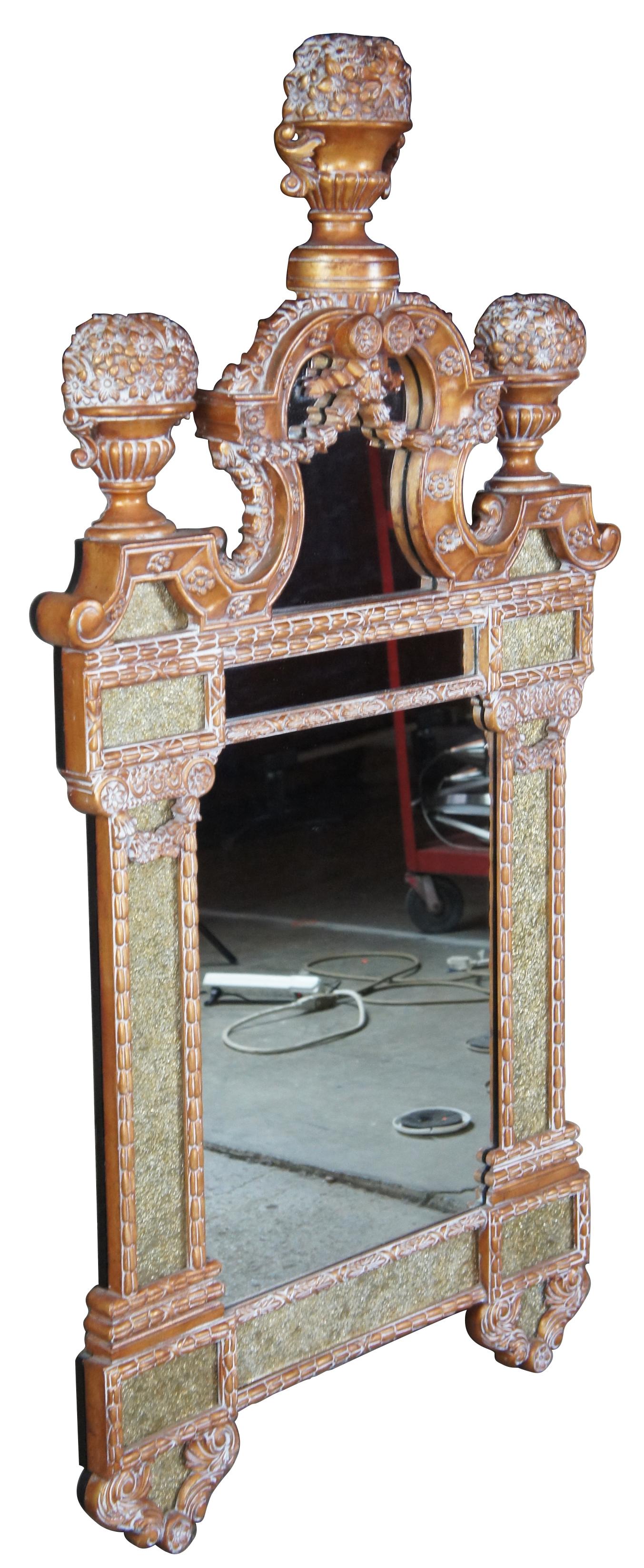 Maitland Smith decorative floral mirror with urn motif, features neoclassical styling with gold applied panels and carved detail throughout. Measure: 61