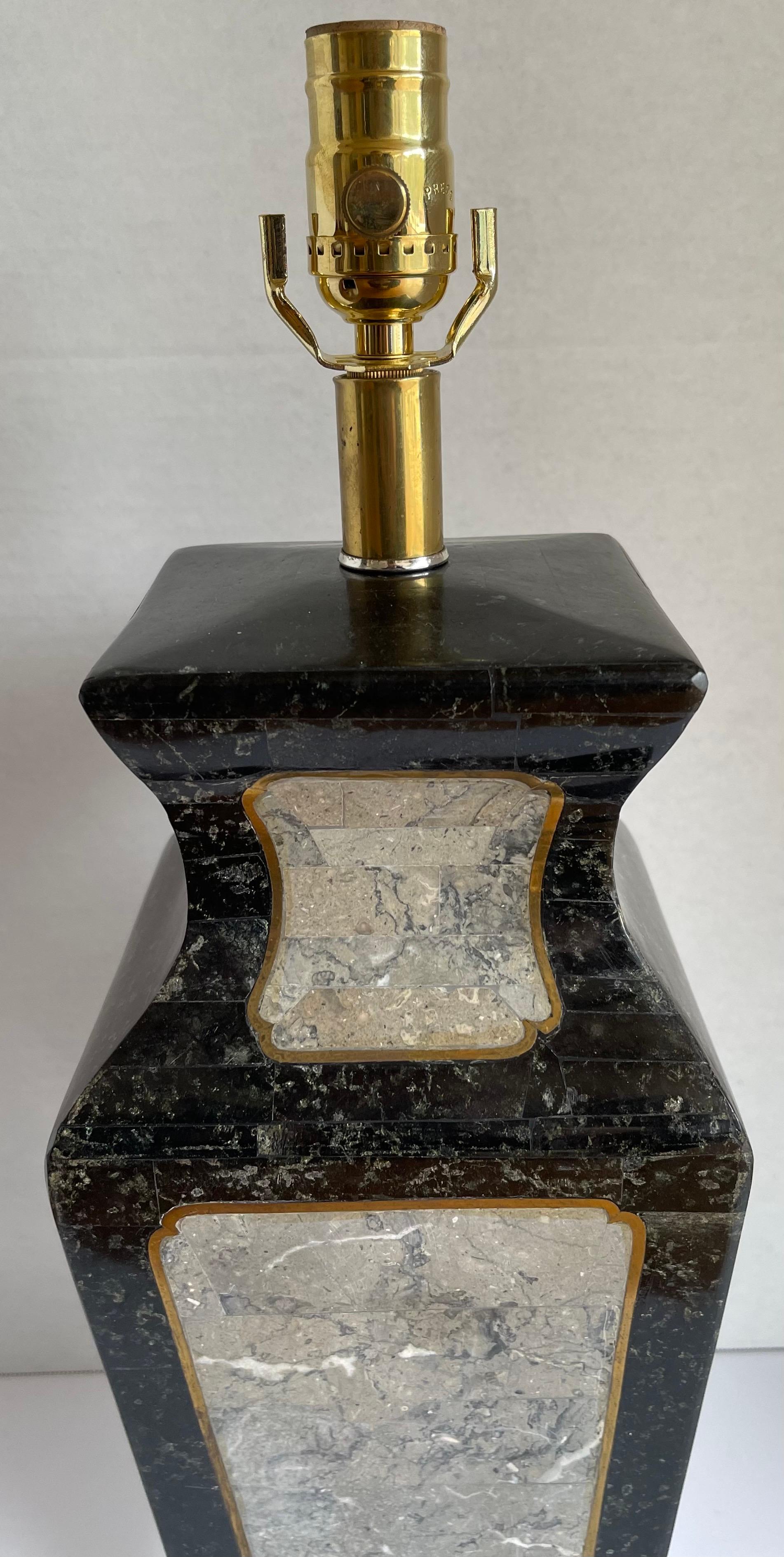 1980s Maitland-Smith stone and brass table lamp. Black and gray stone with brass inlaid detailing. Original square lucite base with beveled edge. Newly rewired with new brass socket. Lamp takes one standard bulb (not included). Lampshade is not