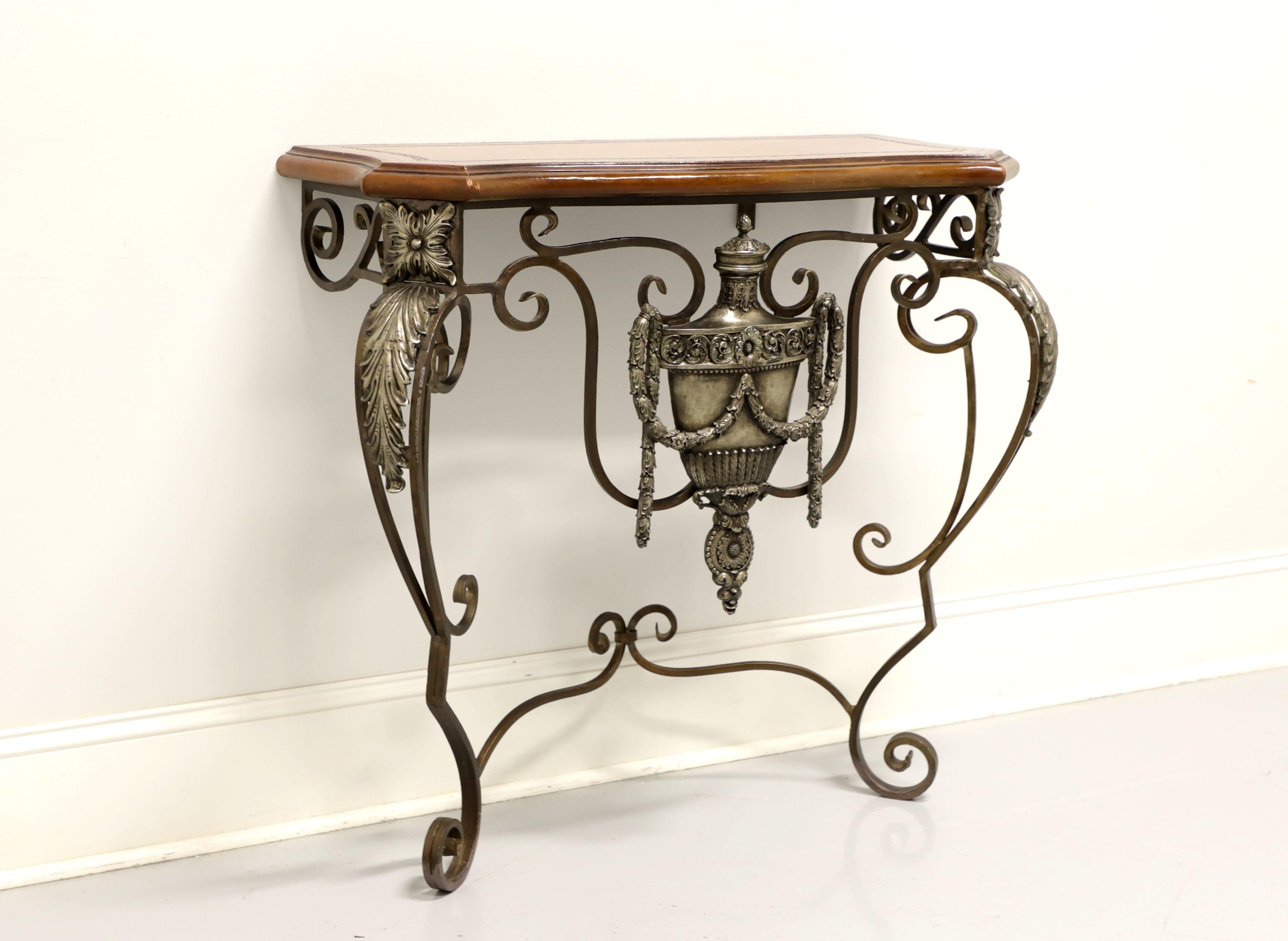 A French style pier table by Maitland Smith. Ornate iron frame with tooled leather top. Features a decorative shield with swags to center, acanthus leaves to knees and curled feet. Wall mounted with two screws. Made in the Philippines, in the late